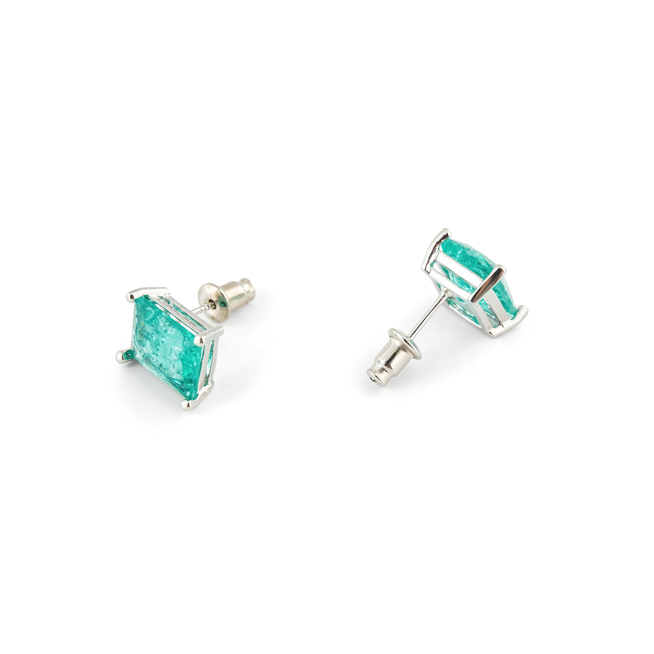 Silver stud earrings with light green crystal