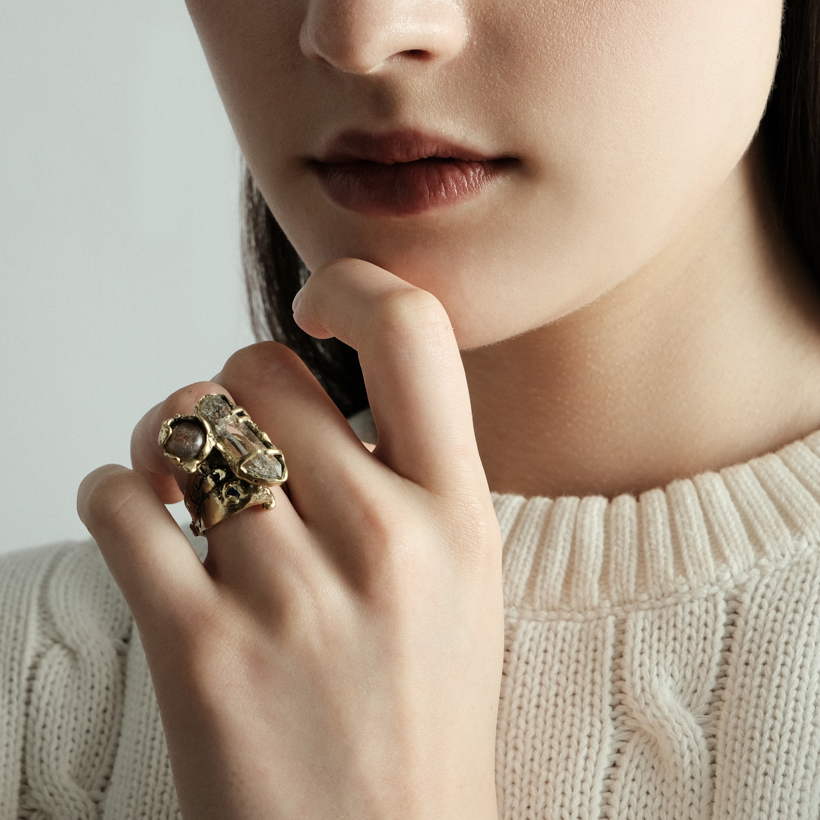 Brass ring with inserts: sunstone, quartz and two cubic zirconia