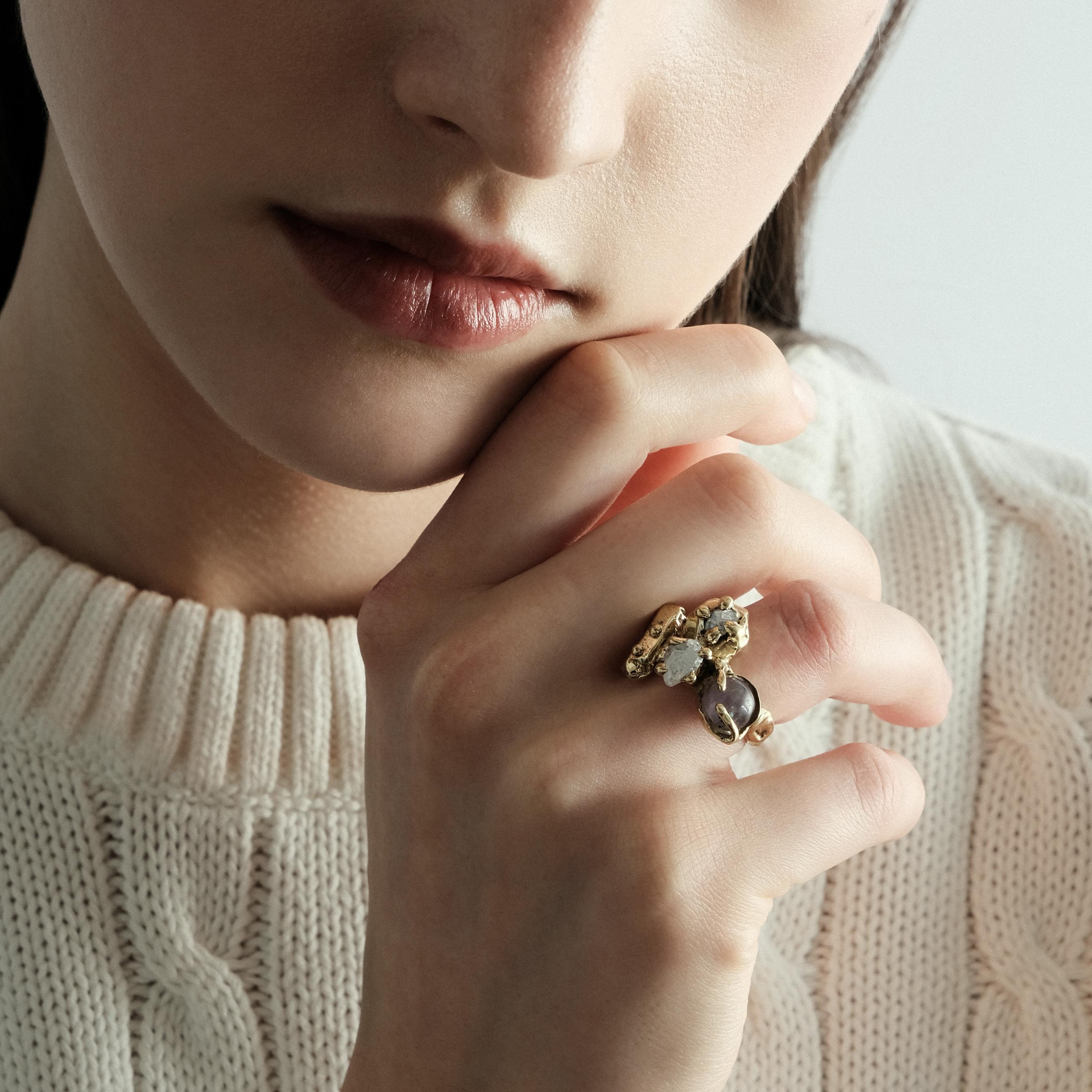 Brass ring with inserts: amethyst and two cubic zirconia
