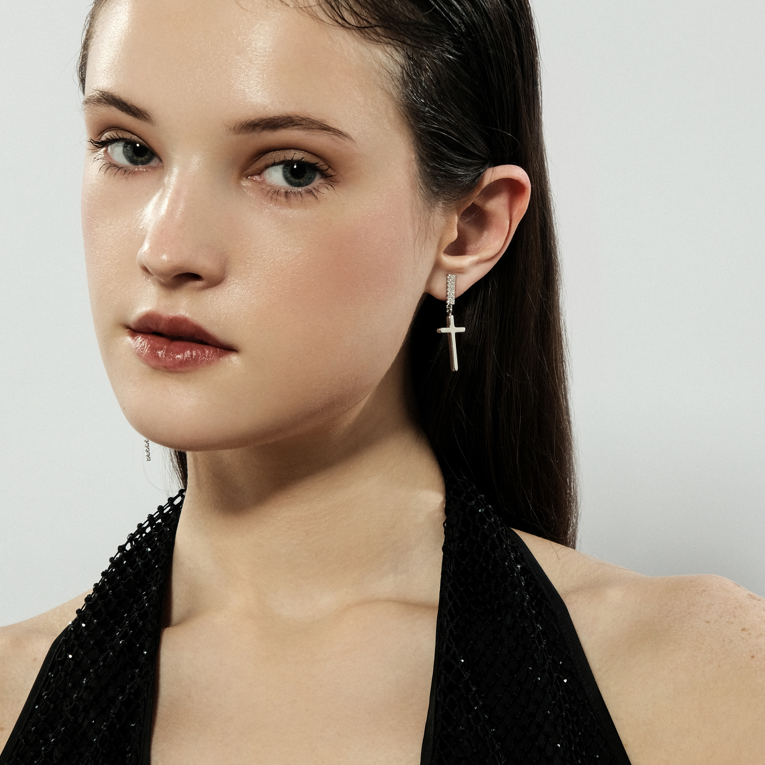 Asymmetric silver cross earrings with crystals