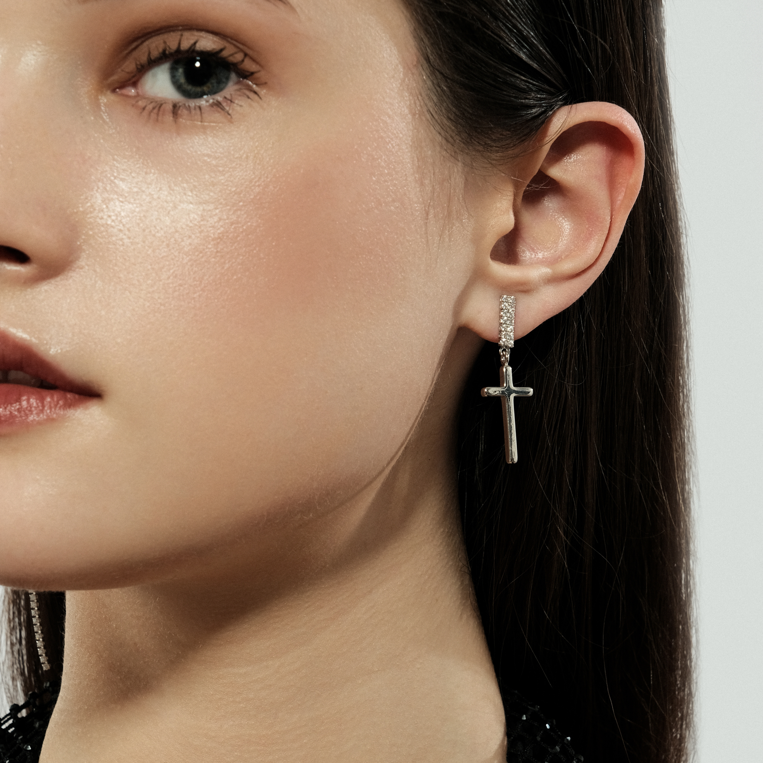 Asymmetric silver cross earrings with crystals