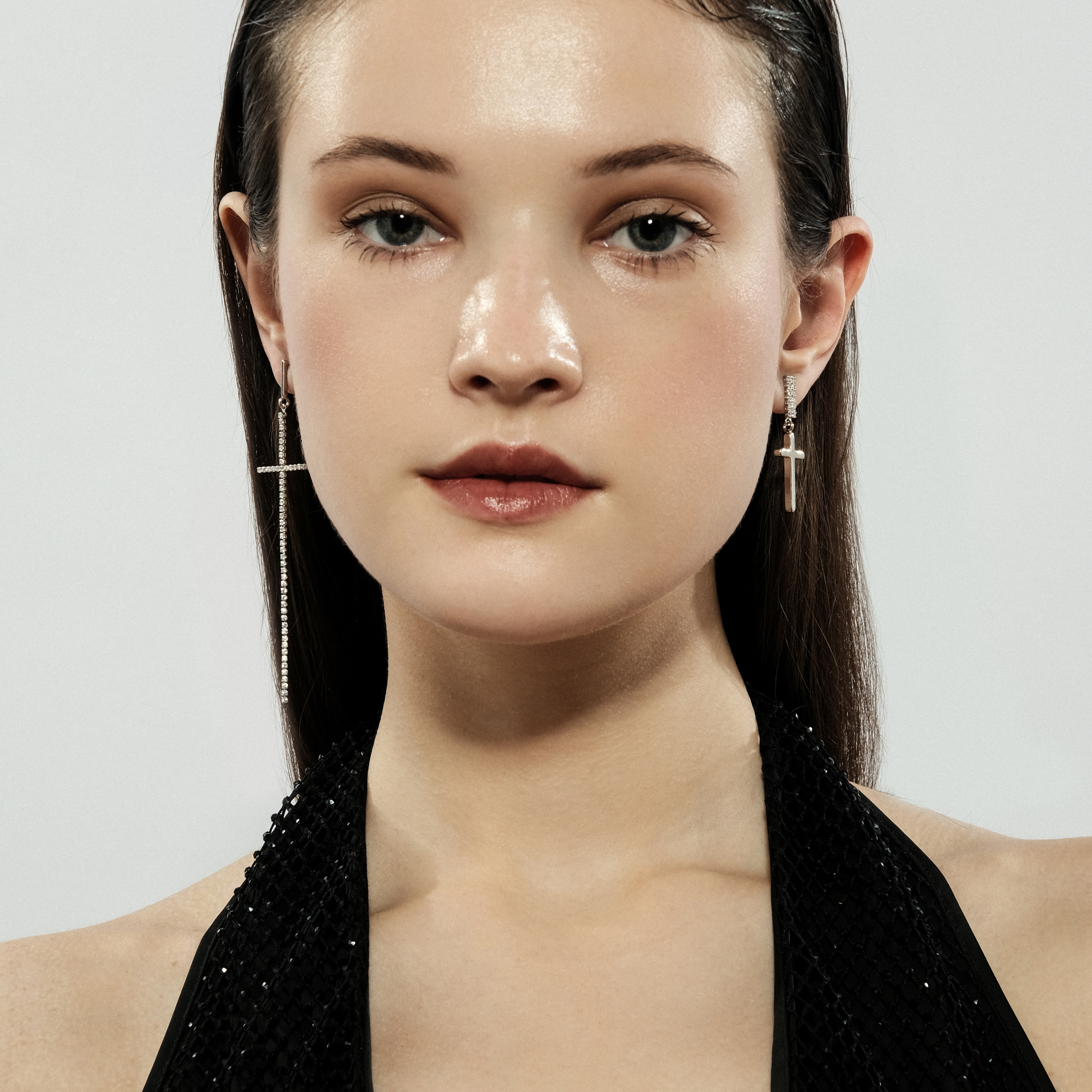 Asymmetric silver cross earrings with crystals