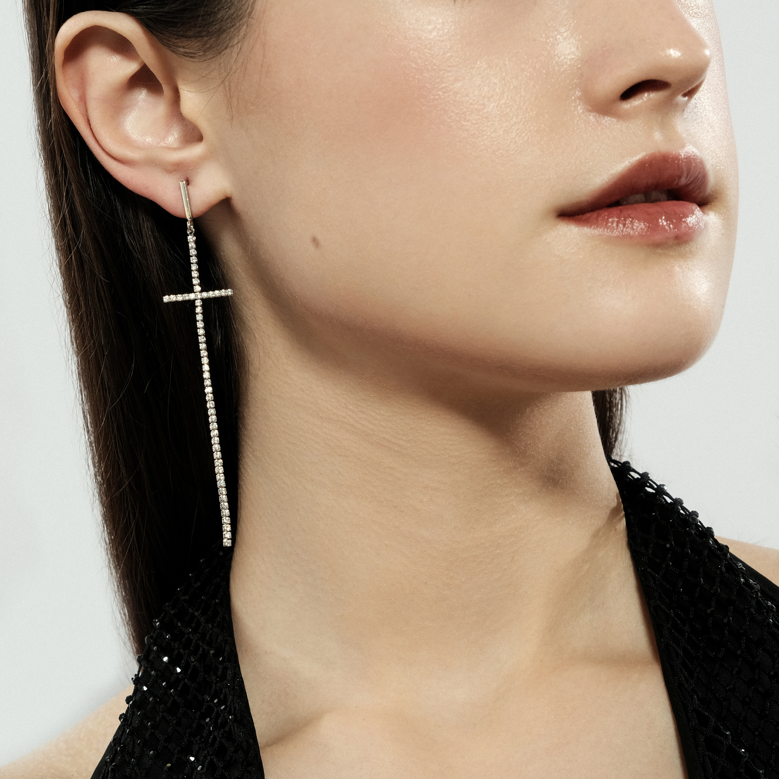 Asymmetric silver cross earrings with crystals