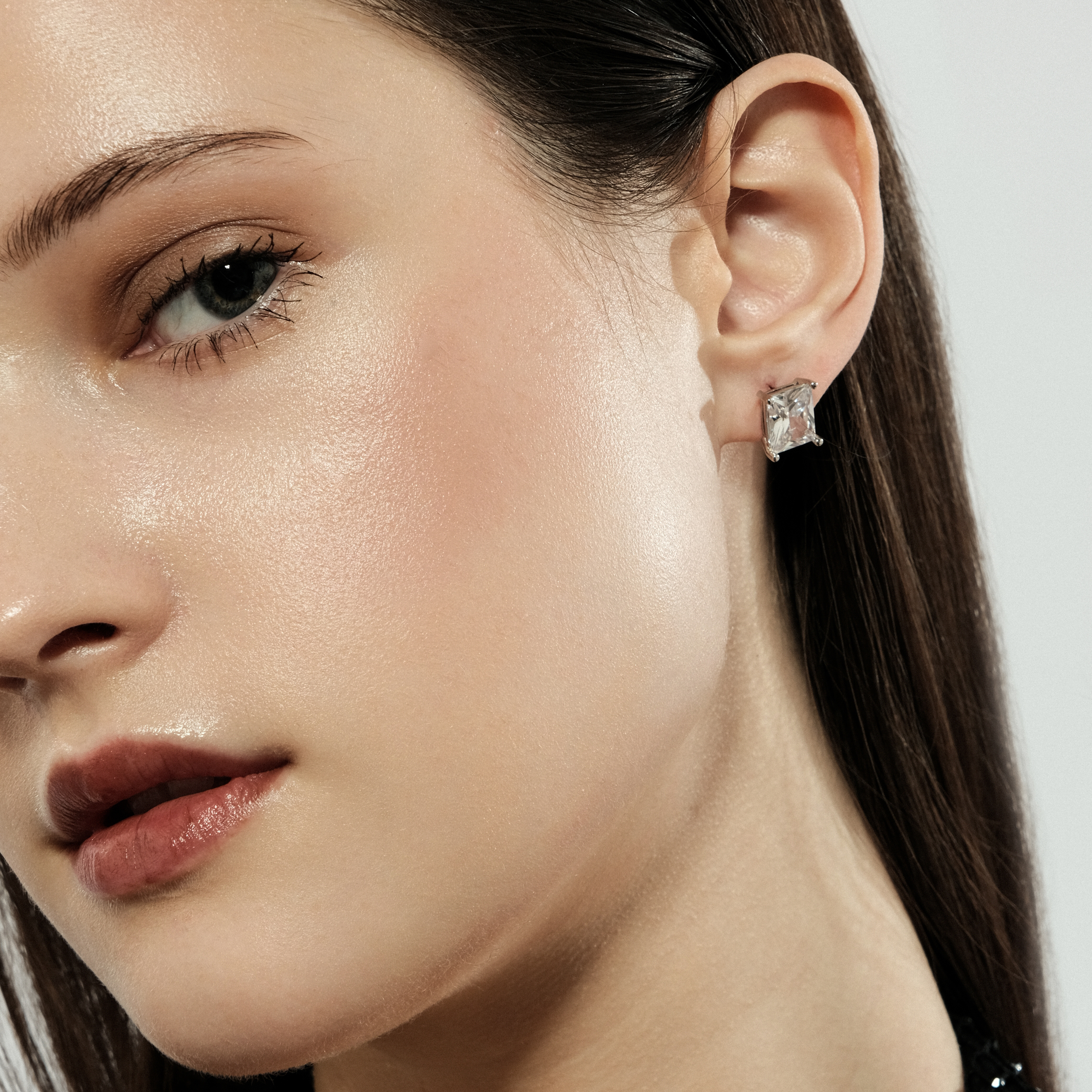 Silver stud earrings with white crystal