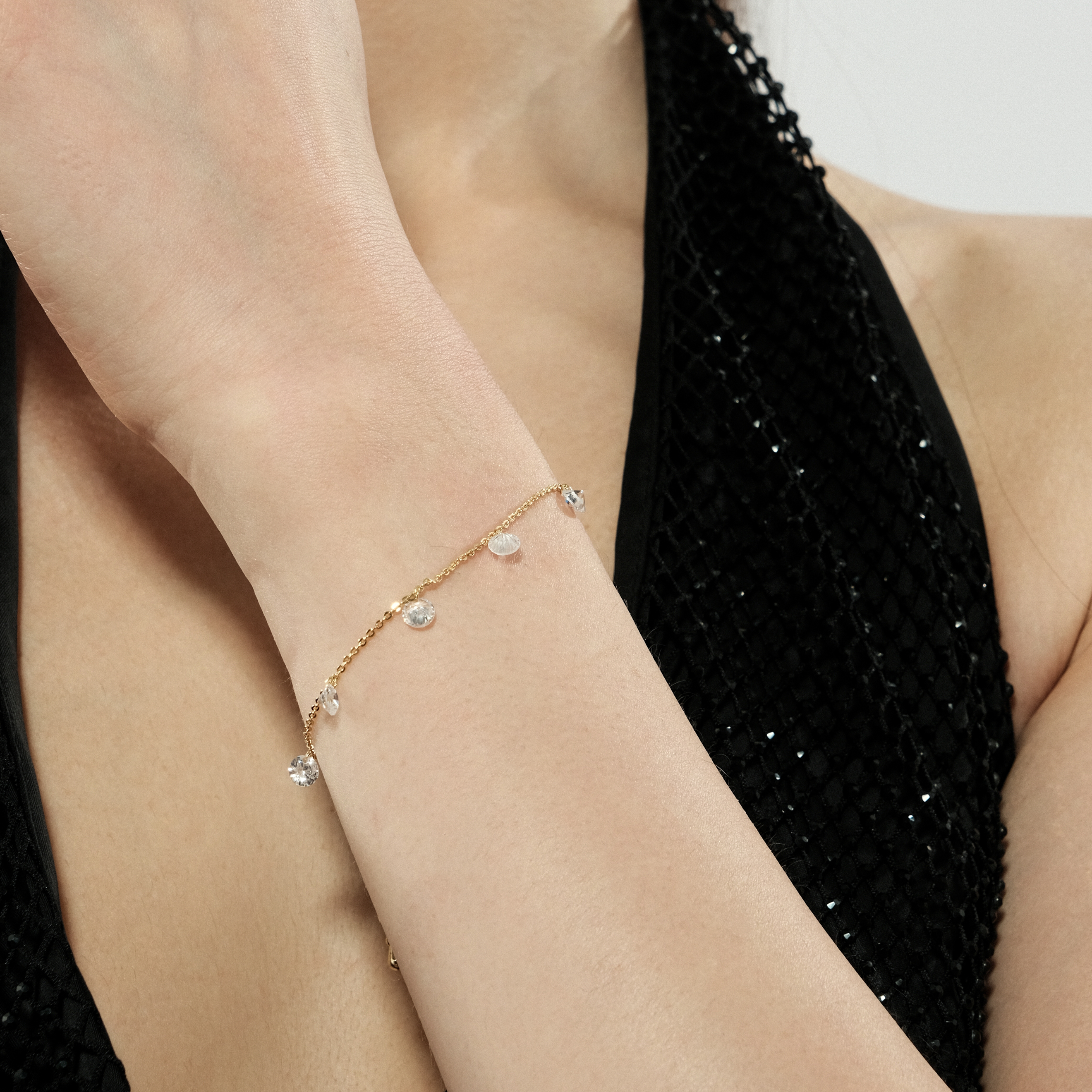 Golden bracelet with crystal pendants