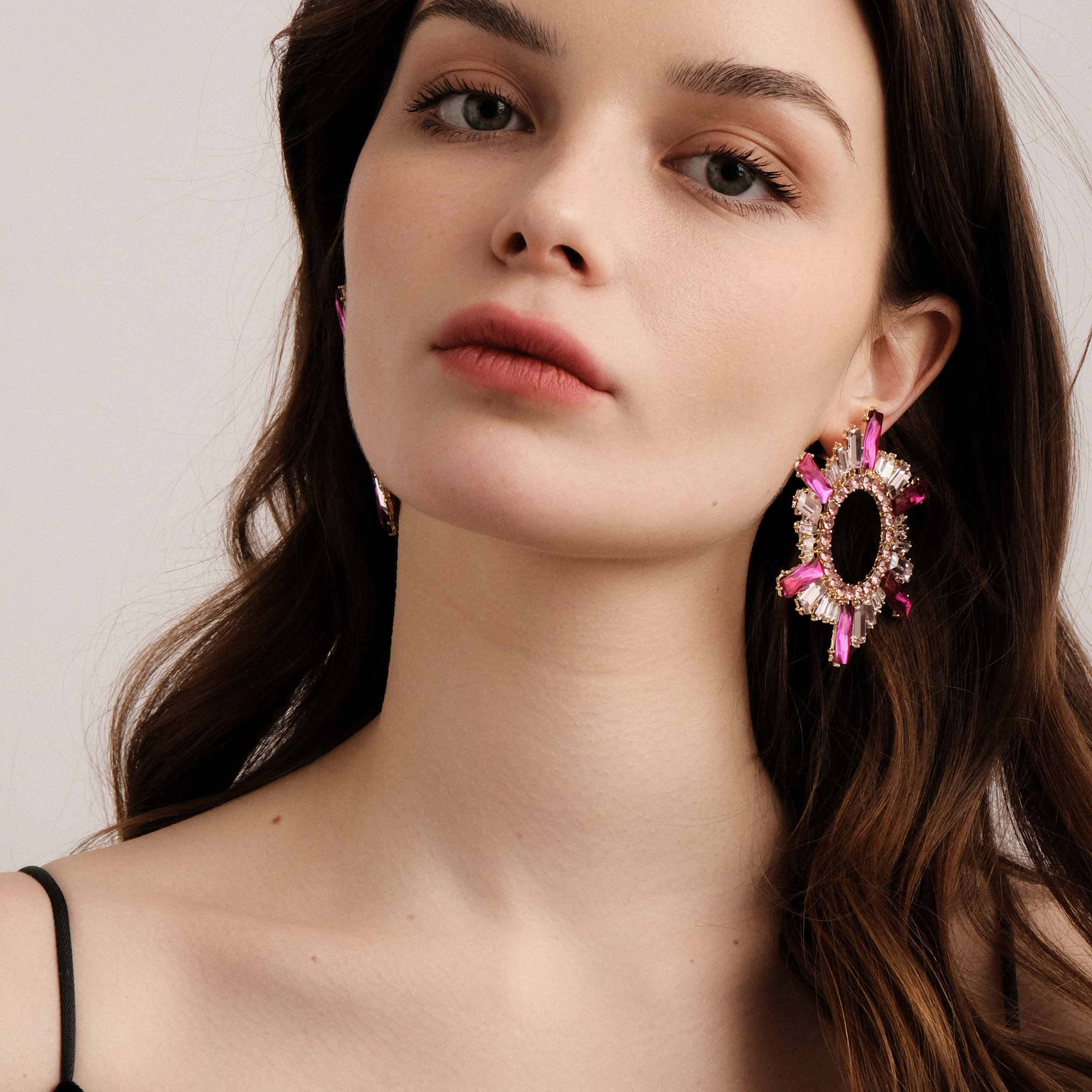 Golden earrings with pink crystals