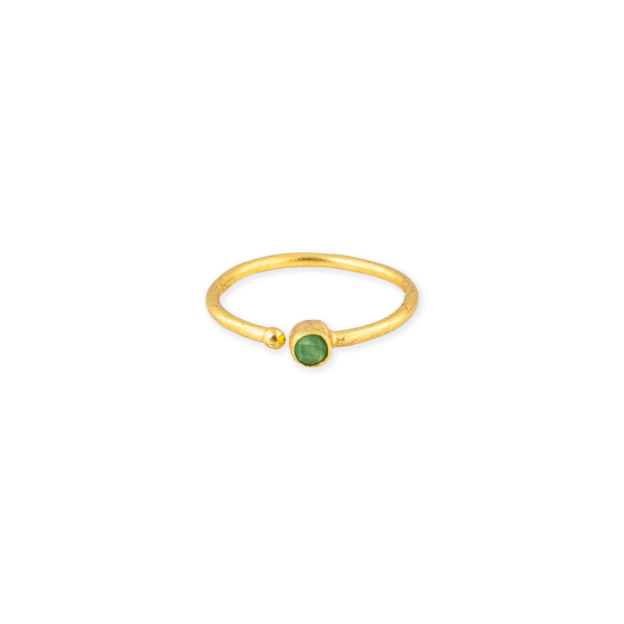 A thin golden ring with a green stone