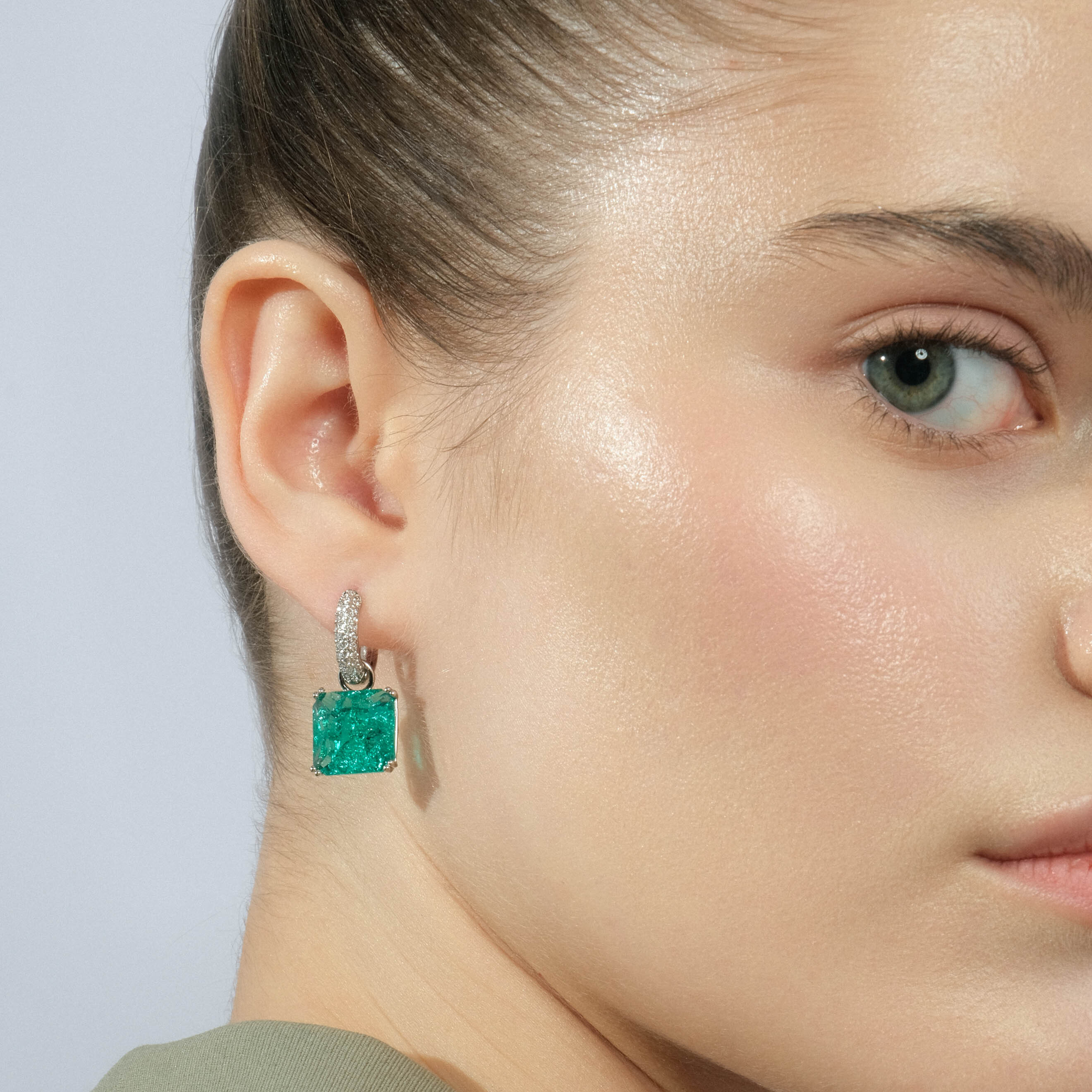 Silver earrings with a square light green crystal and a peacock