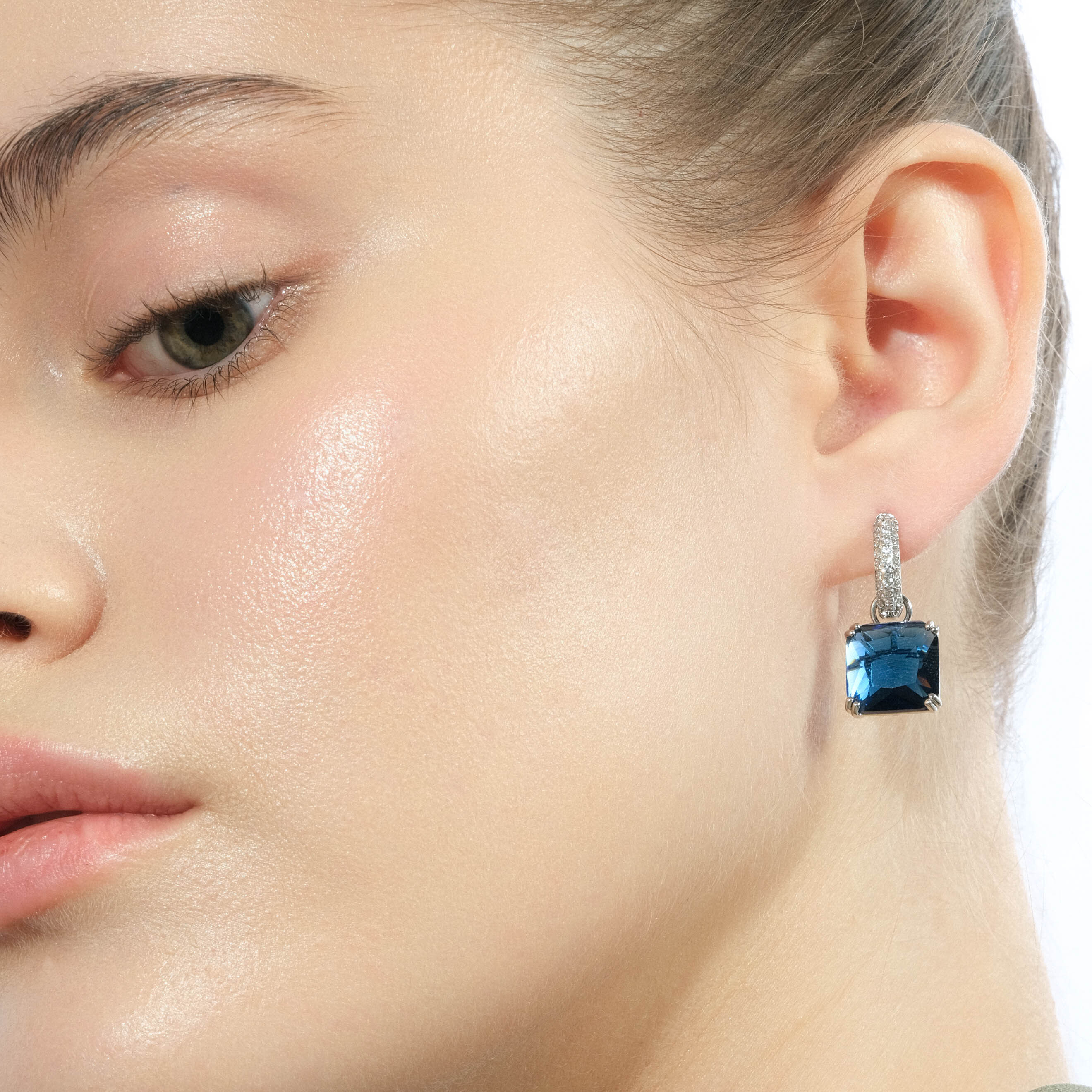 Silver earrings with square dark blue crystal and peacock