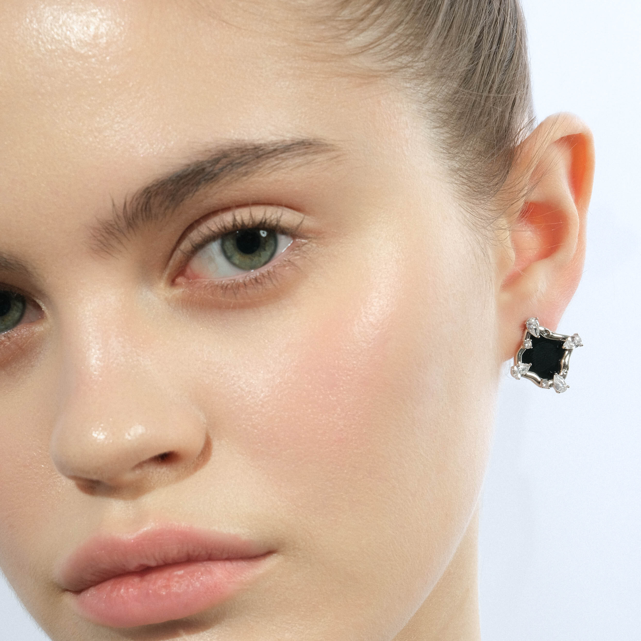 Silver stud earrings with black insert and white crystals