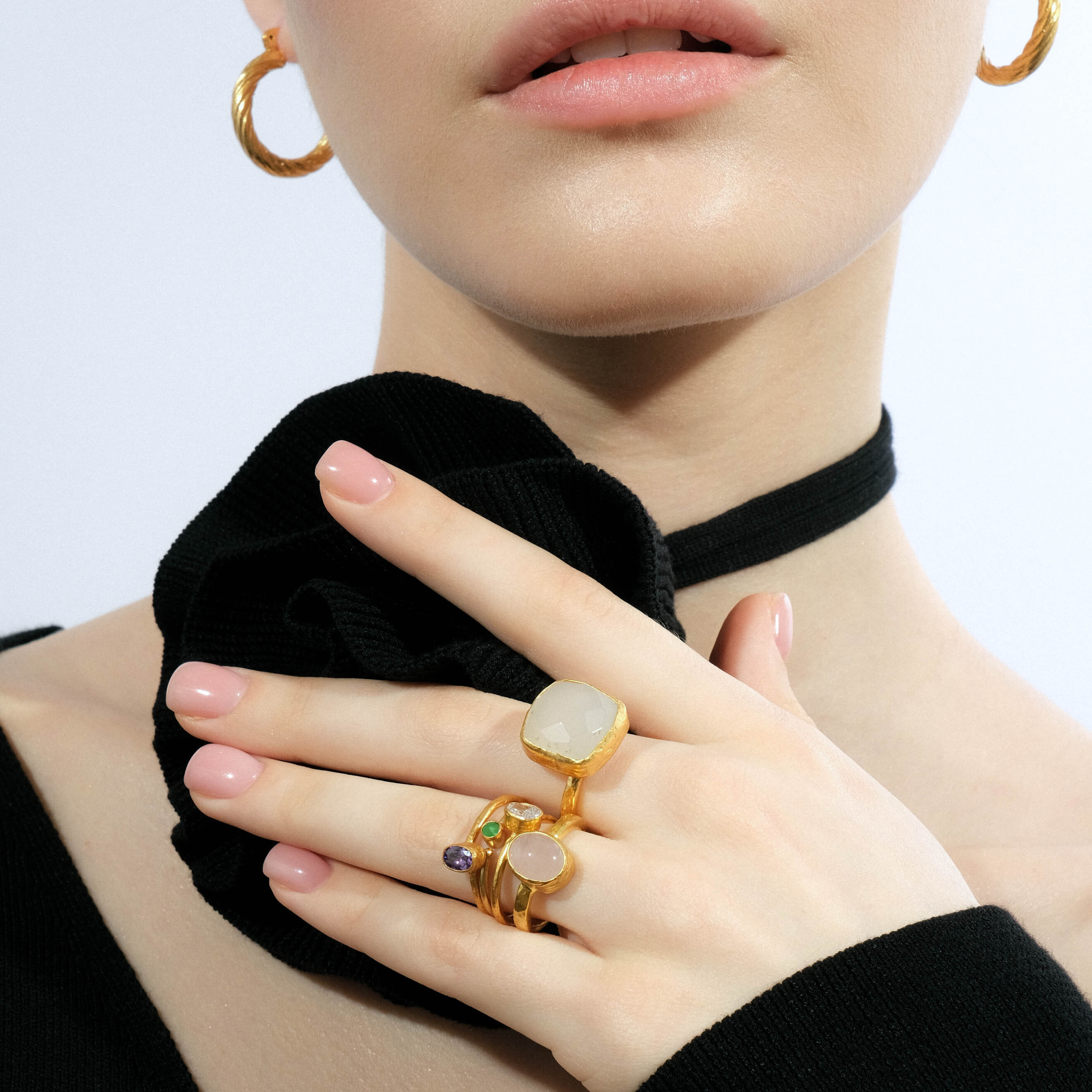 A thin golden ring with a green stone