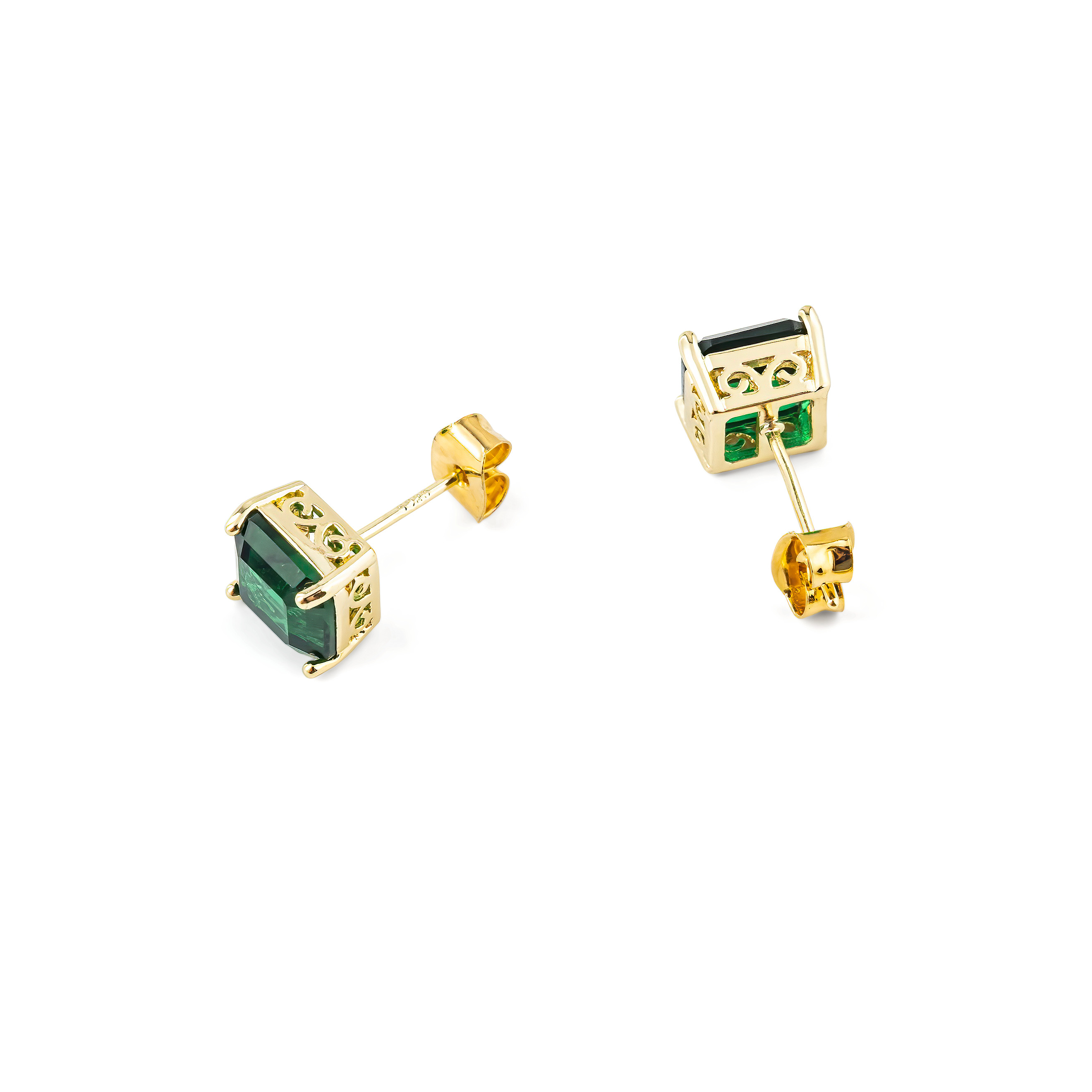 Golden earrings with green crystals