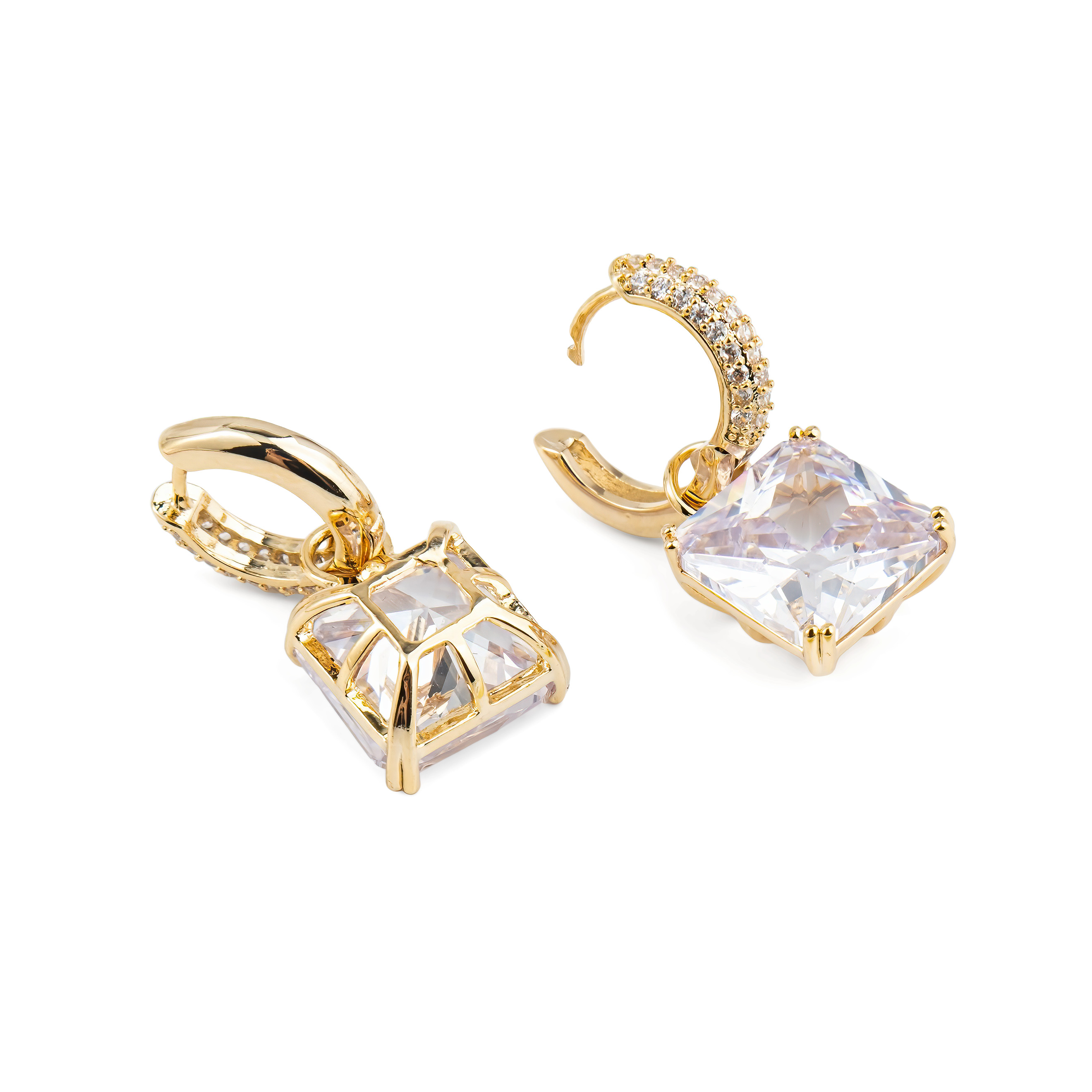 Golden earrings with a square white crystal and a peacock
