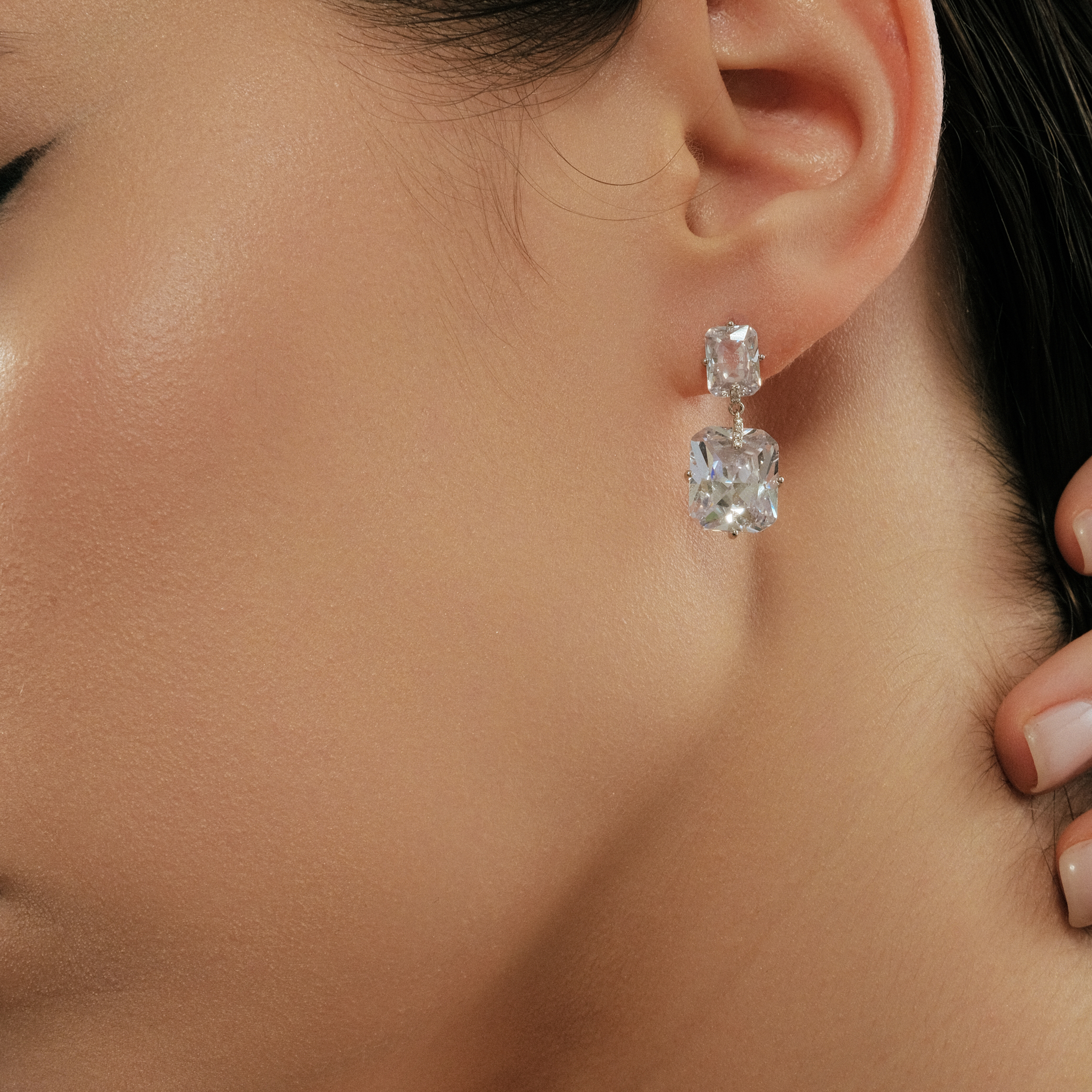 Silver earrings with two white crystals