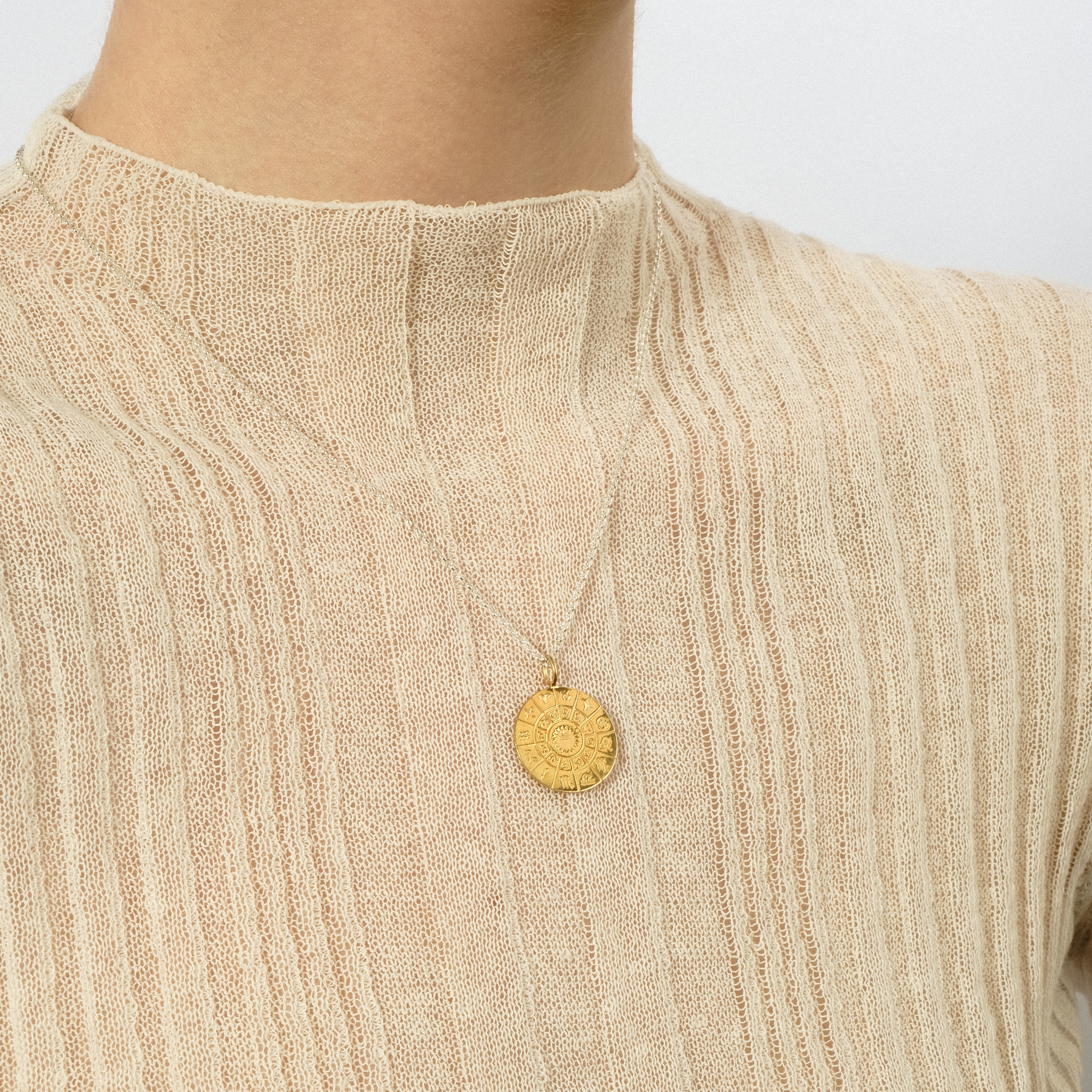 The All is one pendant is gilded