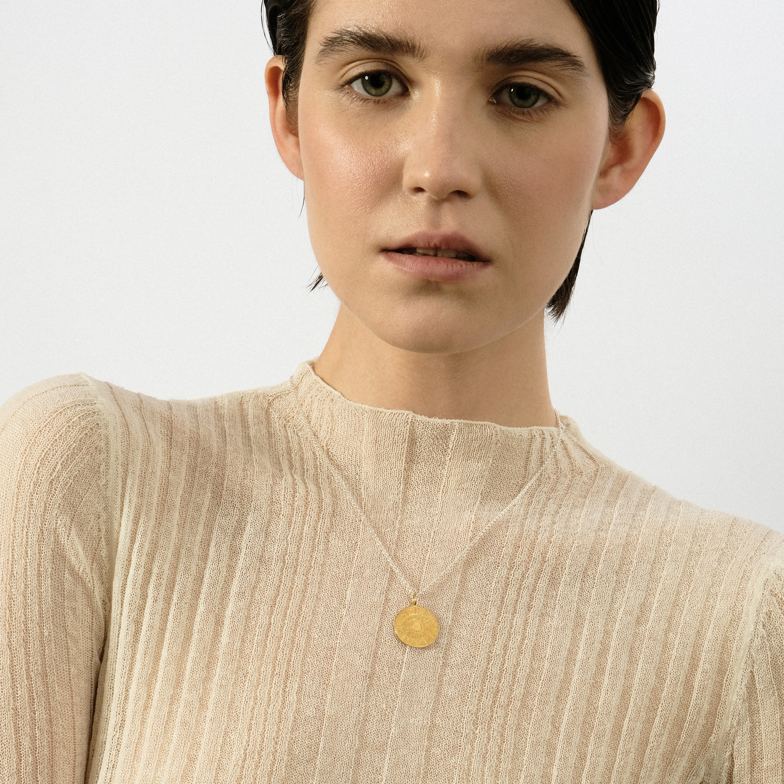 The All is one pendant is gilded
