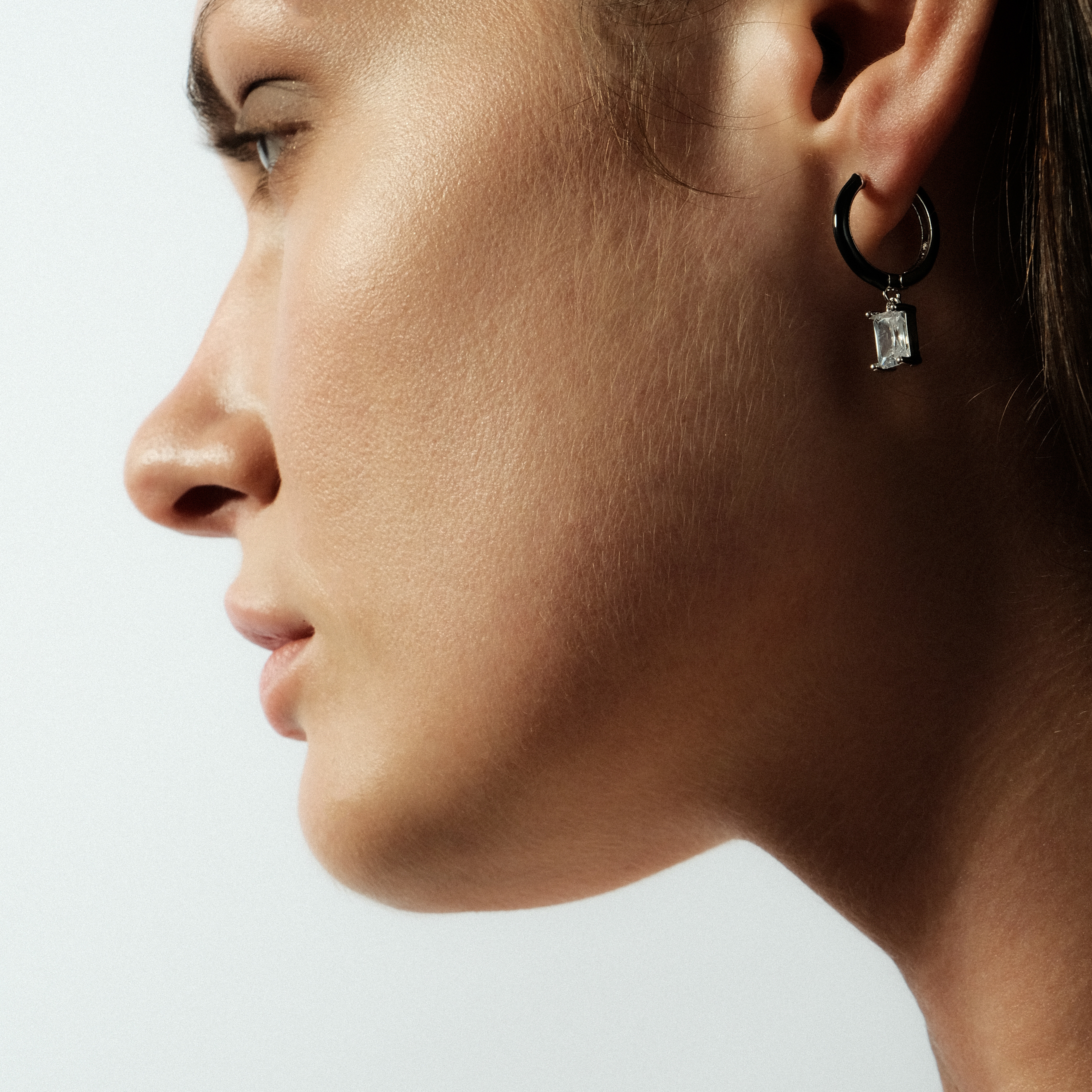 enamel earrings with a baguette cut pendant