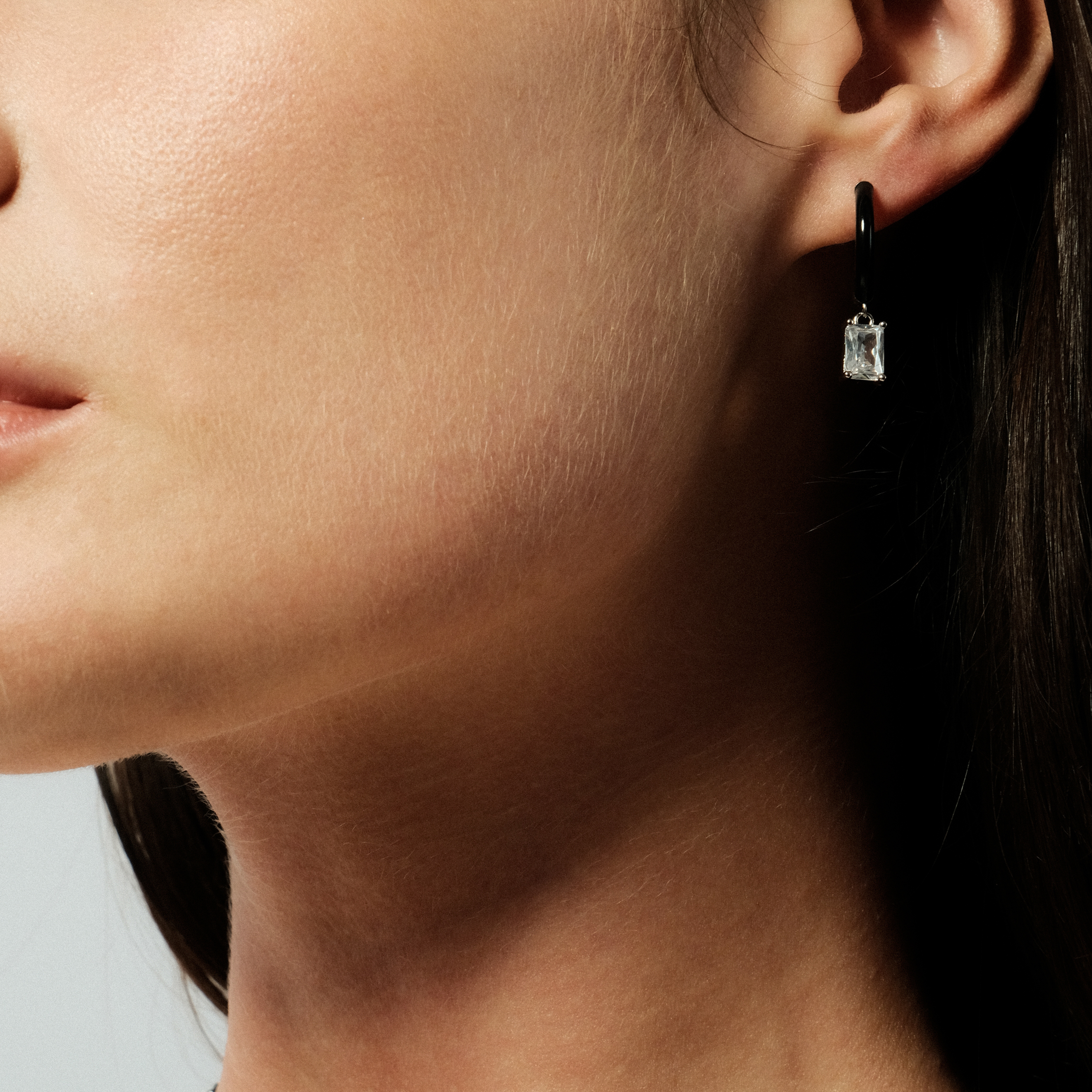enamel earrings with a baguette cut pendant