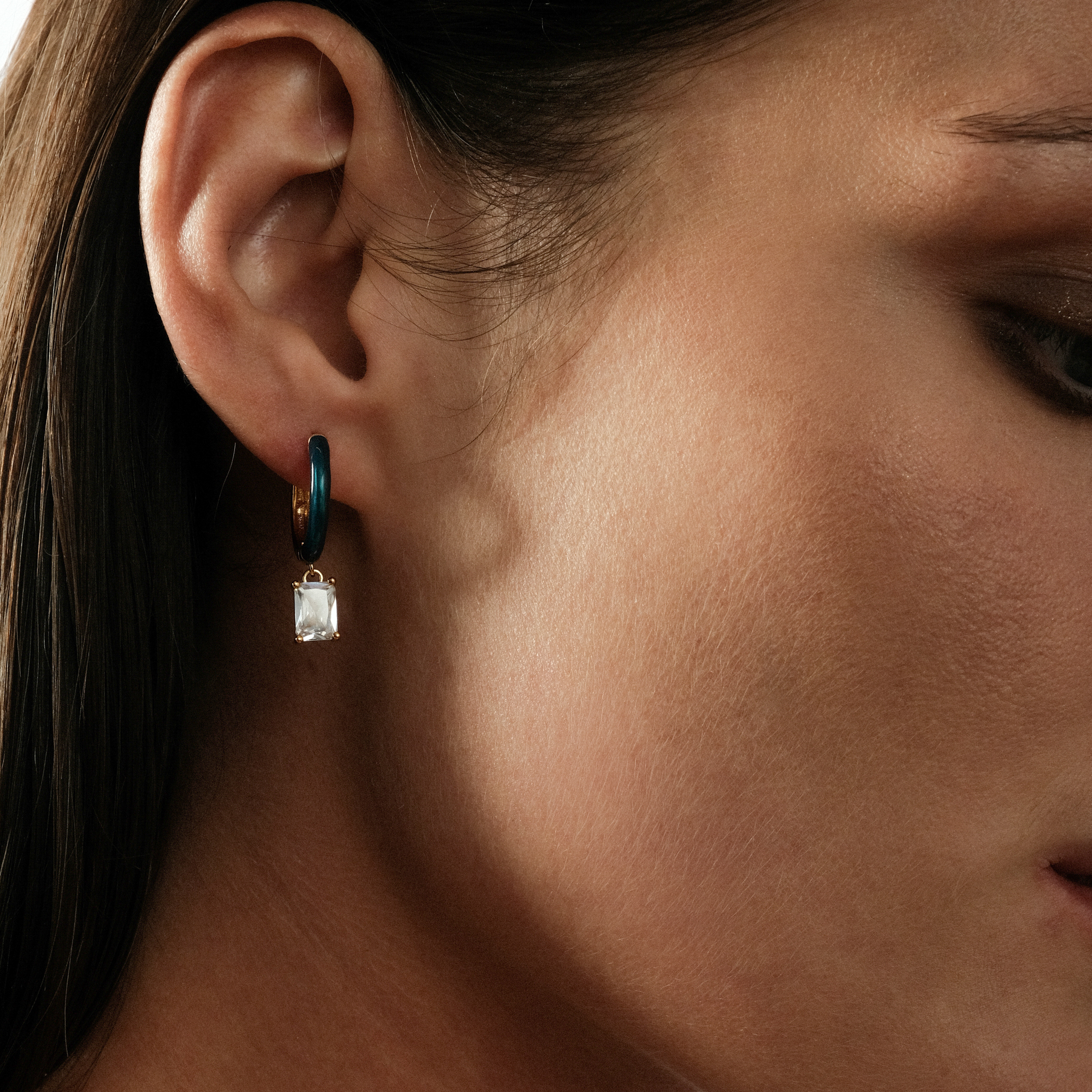 earrings with blue enamel with a baguette crystal pendant