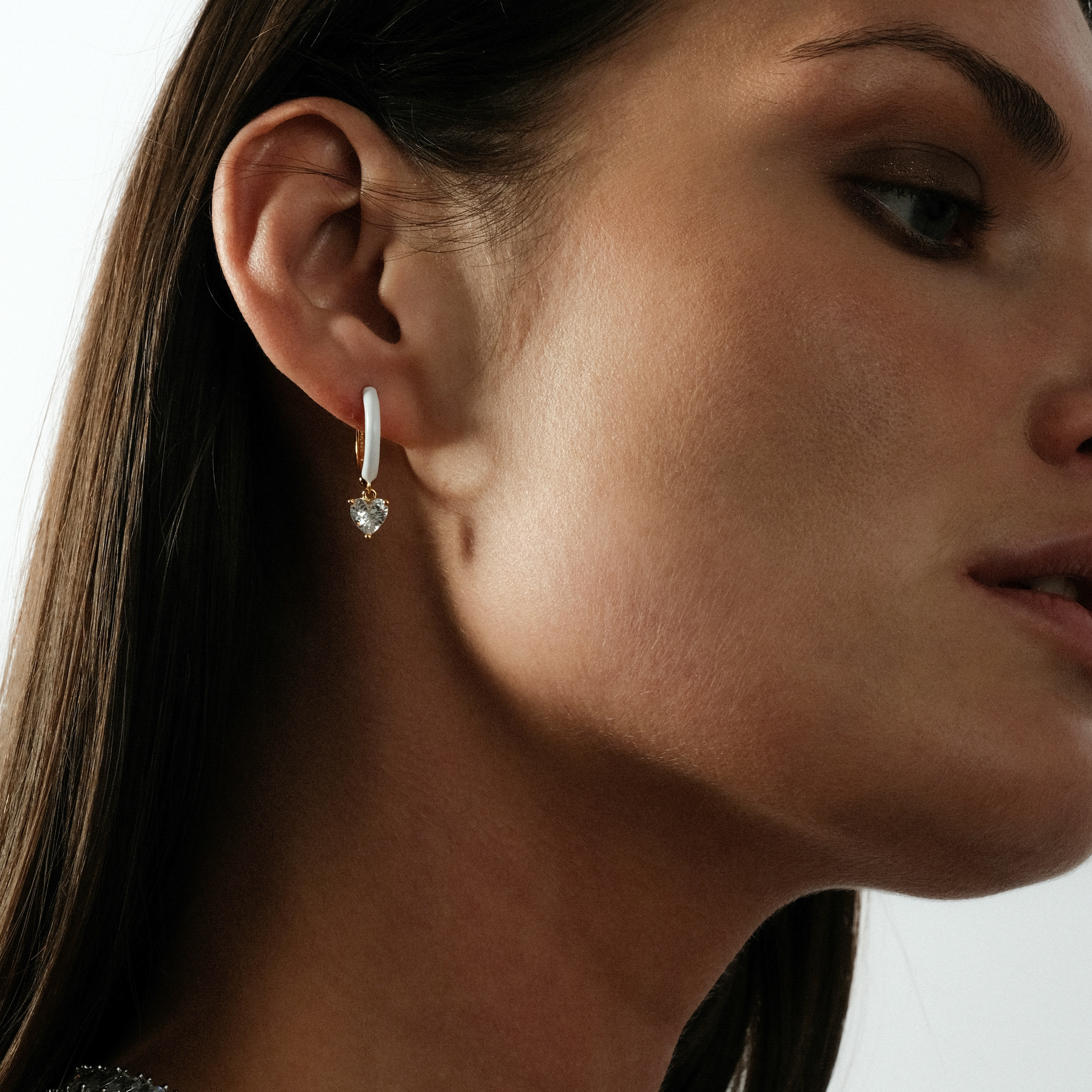 gold-tone enamel earrings with a heart pendant