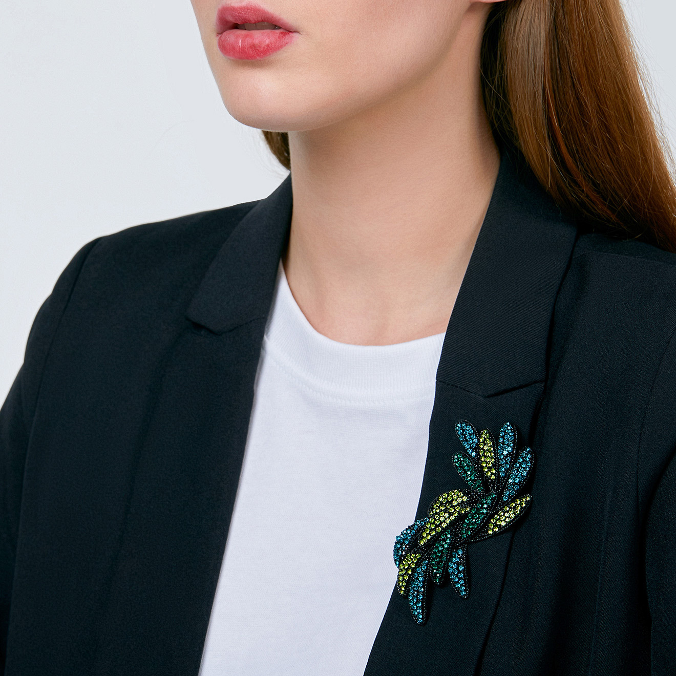 Brooch-branch with green crystals