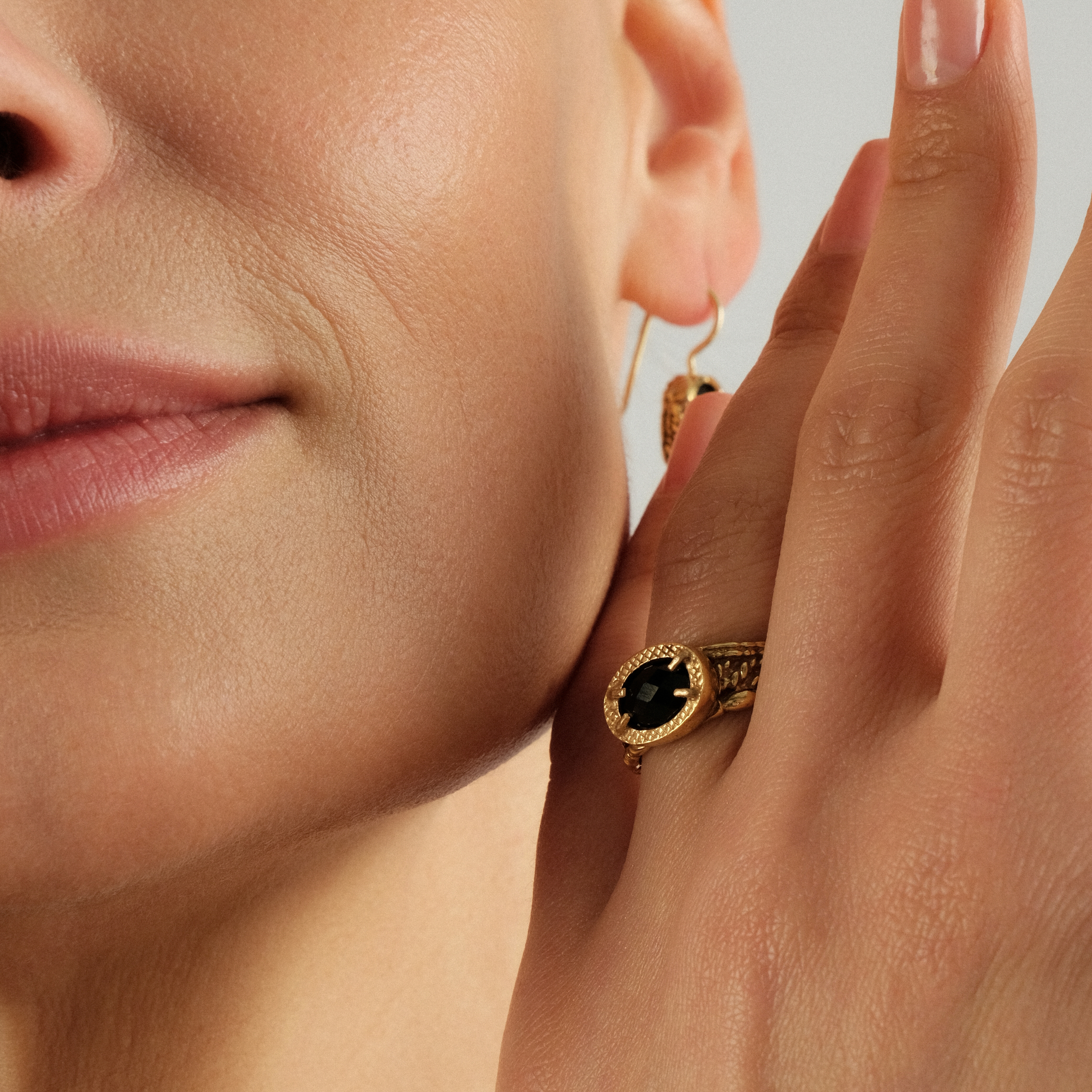 Golden ring with black spinel