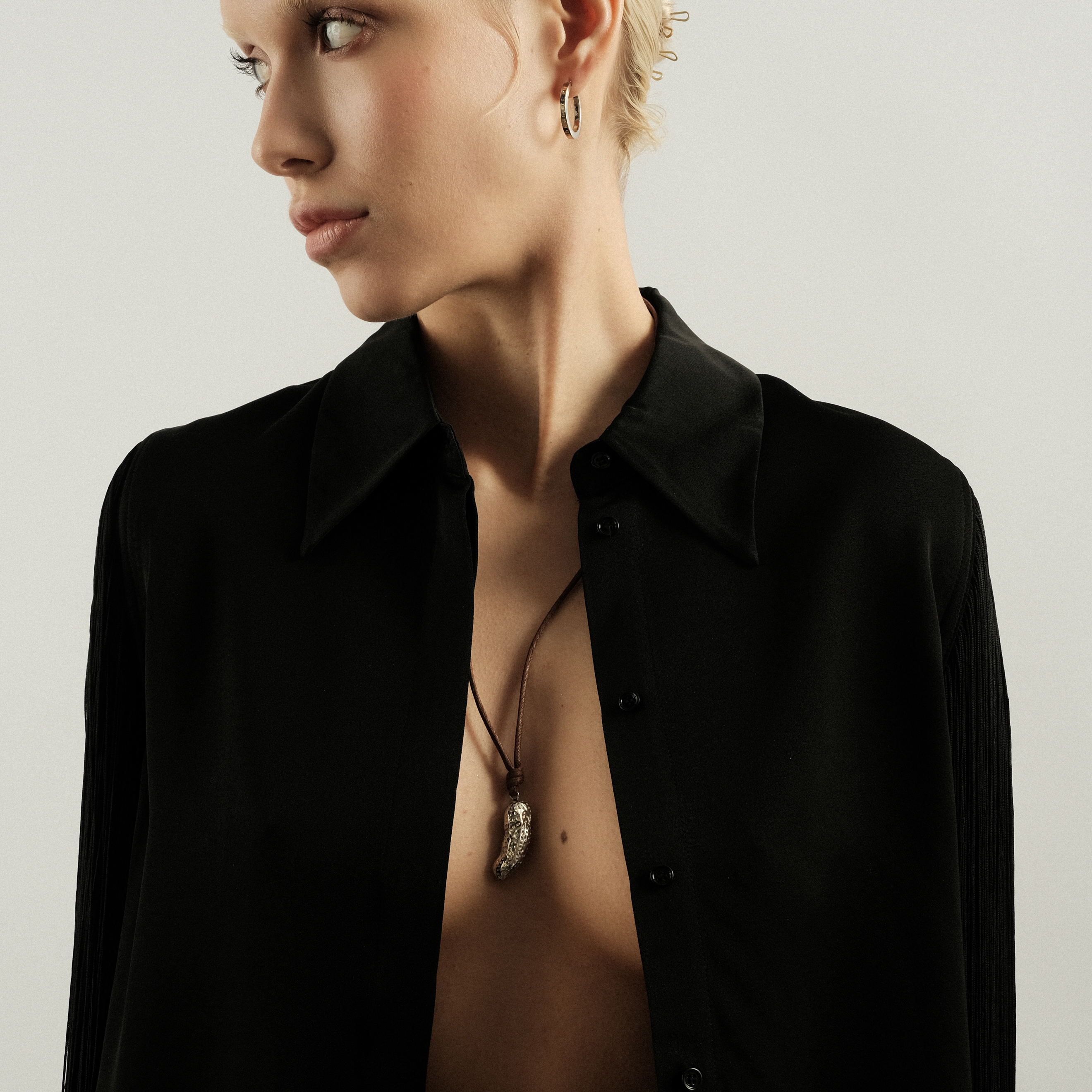 Silver pendant on a cotton cord SS23