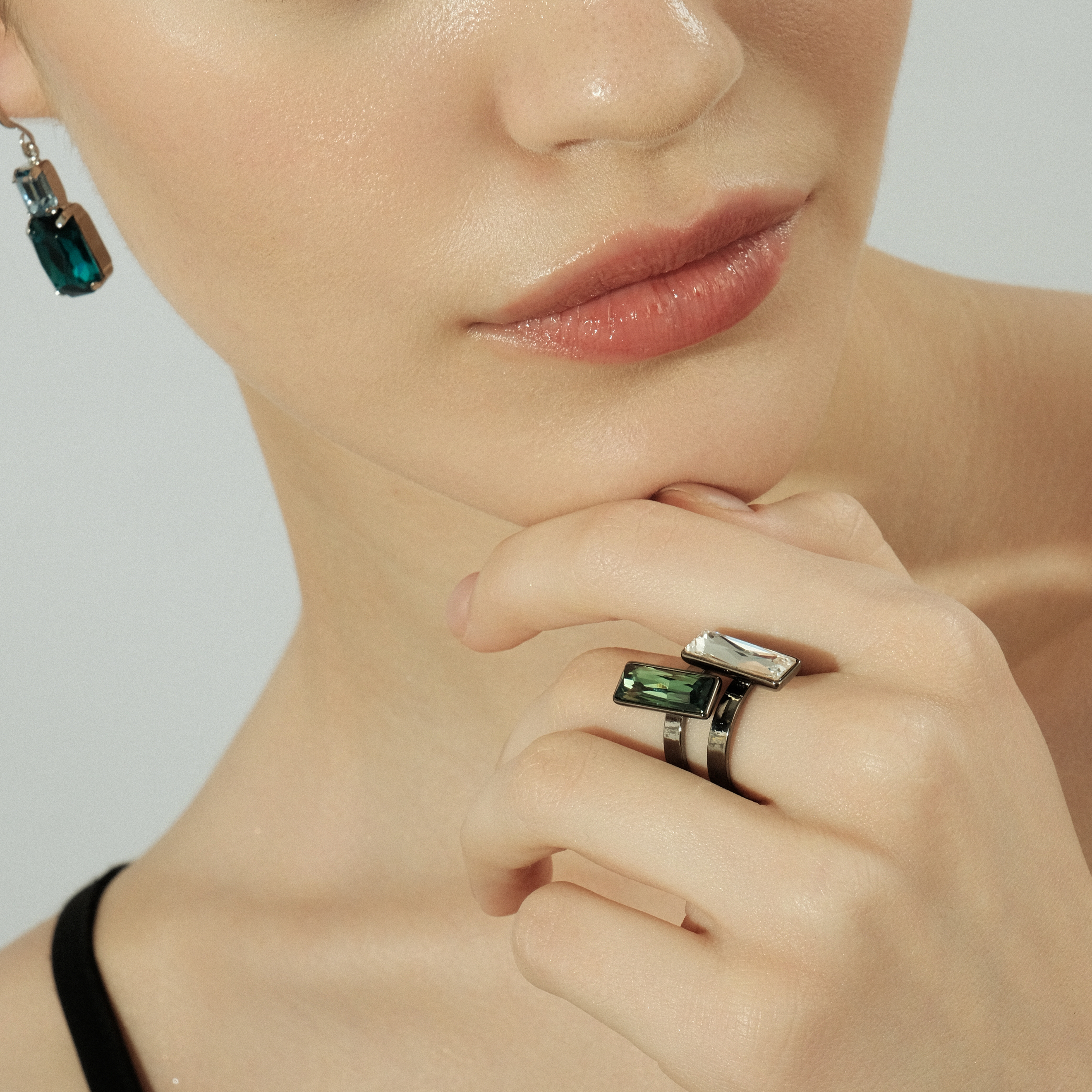 Blackened ring with green crystal