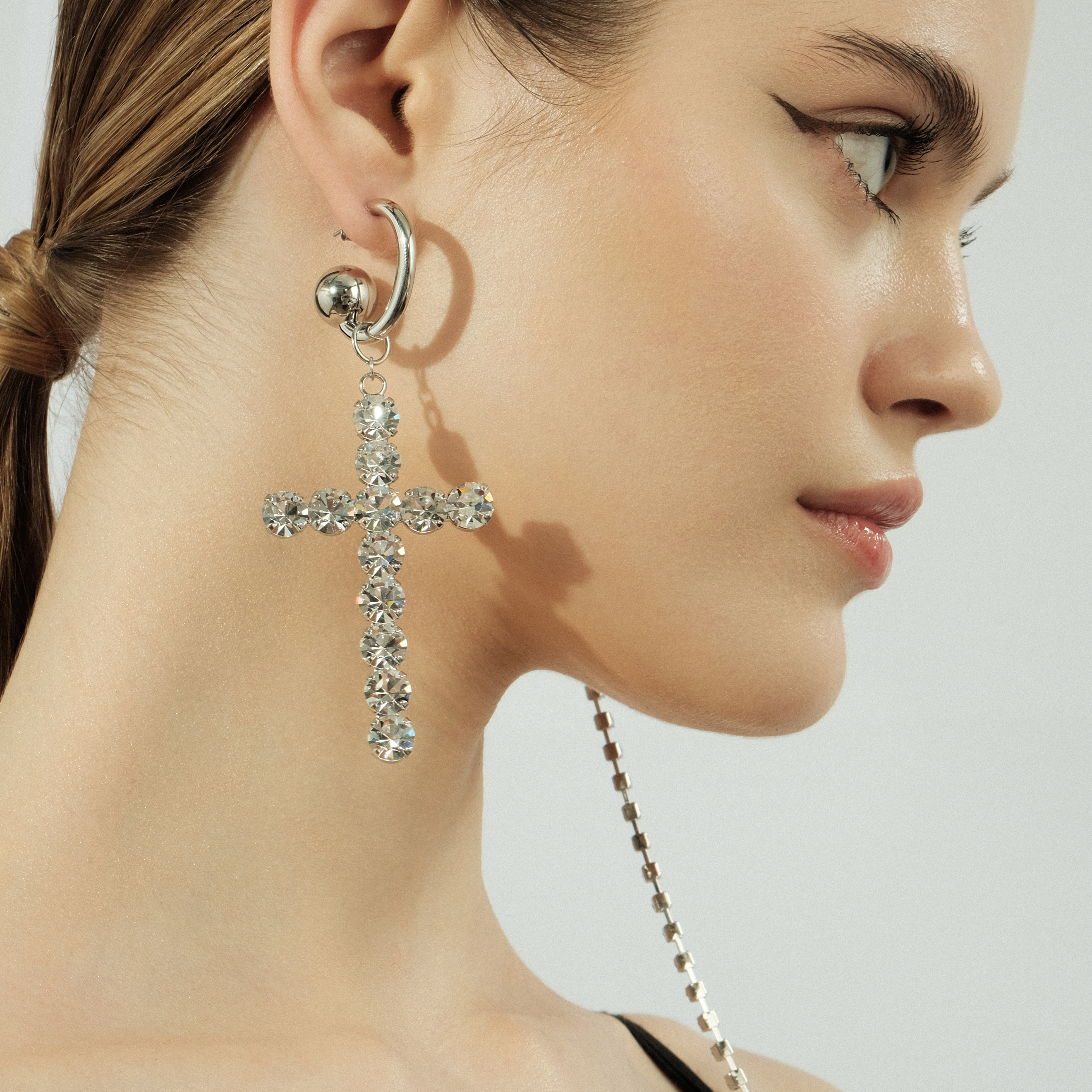 Asymmetric  earrings with a cross and crystals
