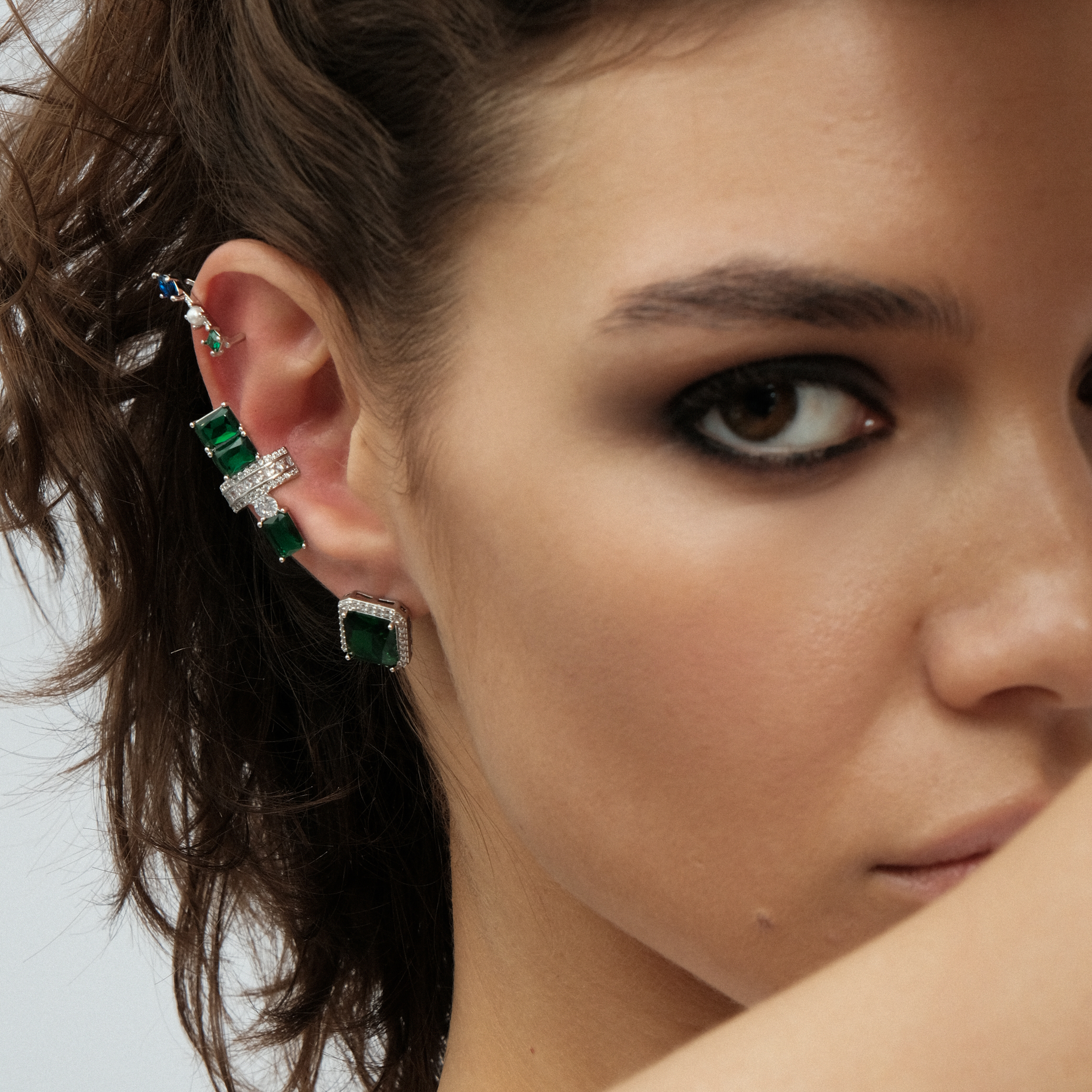silver-tone mono earring and cuff set with large green crystals