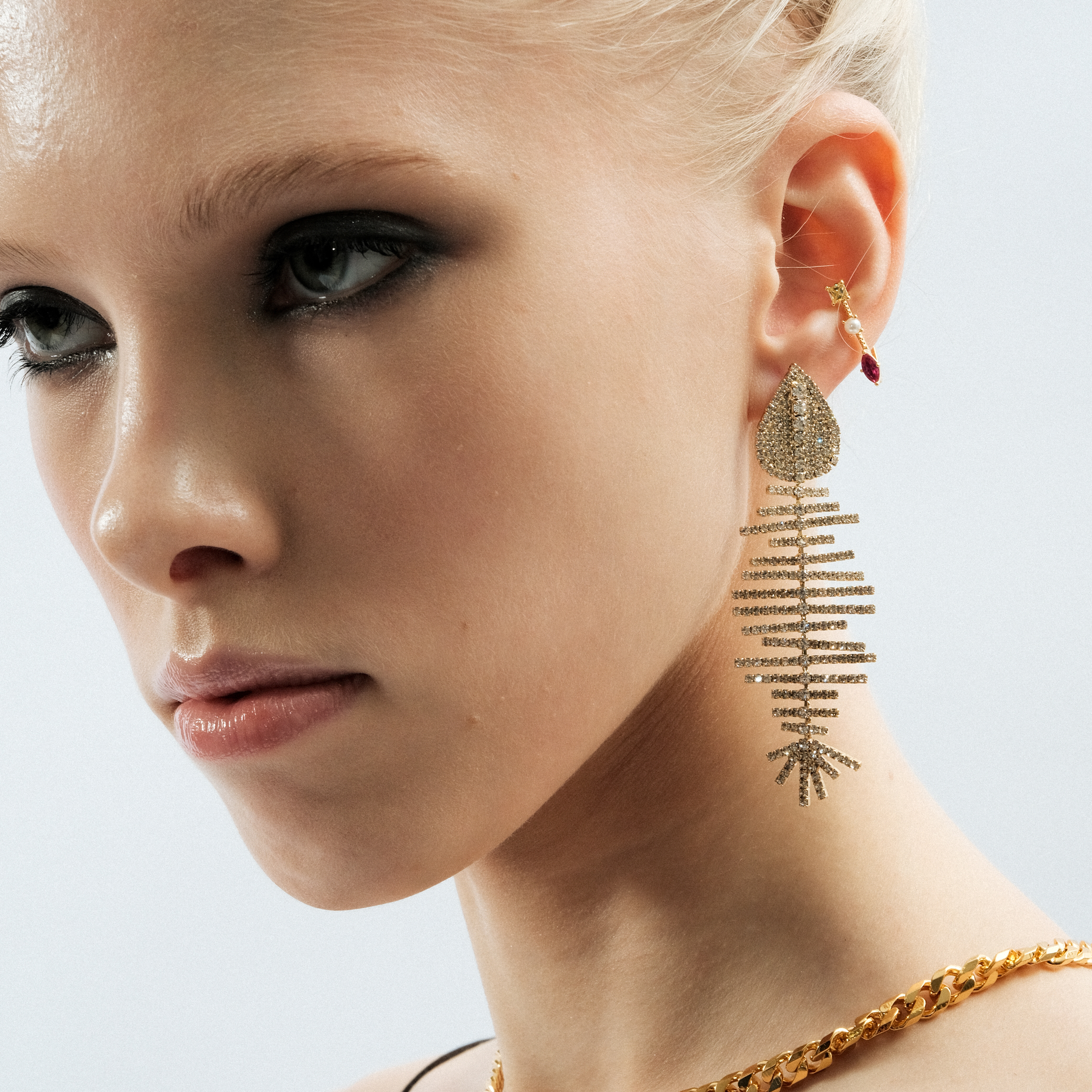 Triangular golden cuff with yellow and pink crystals