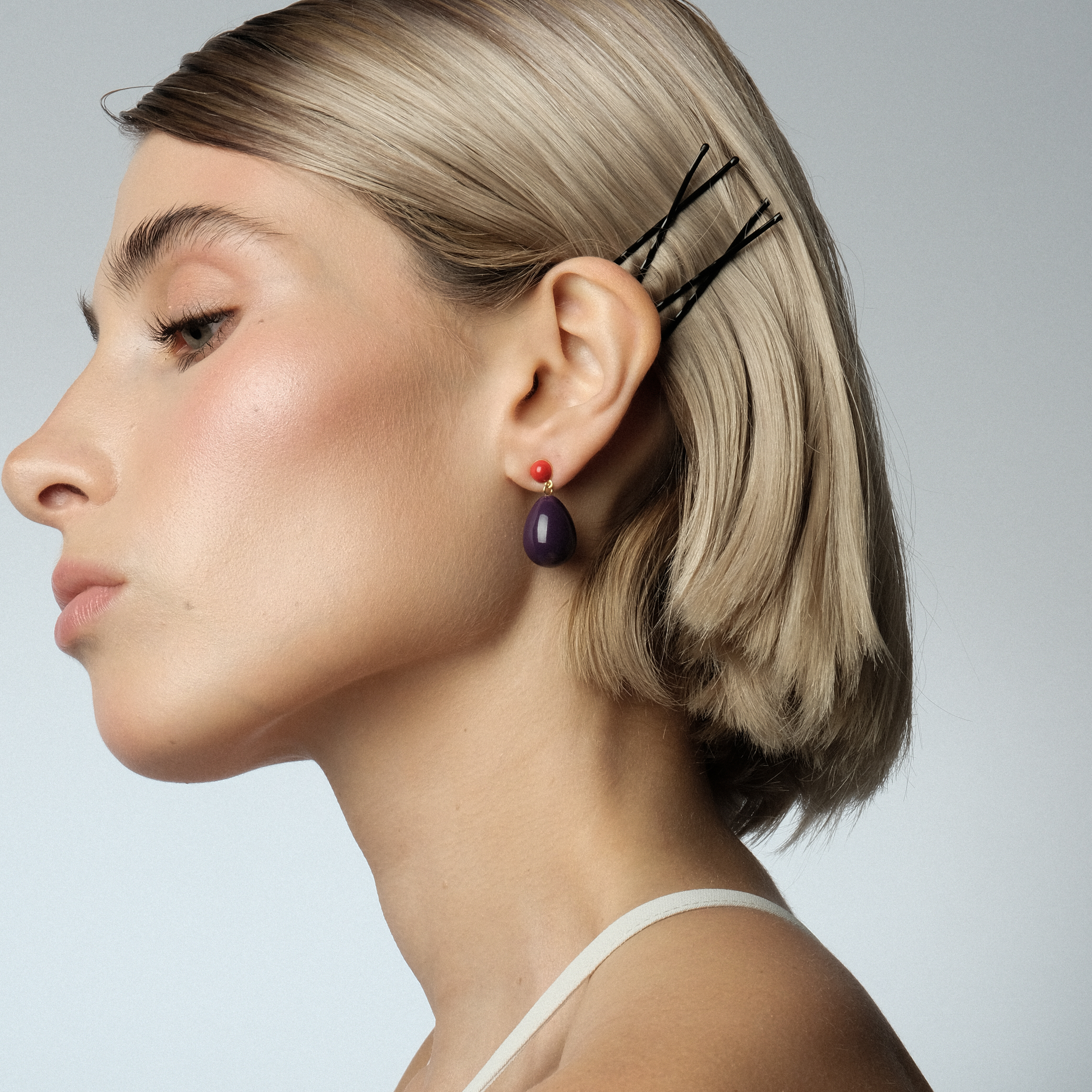 Small gold-plated silver earrings with purple and red enamel