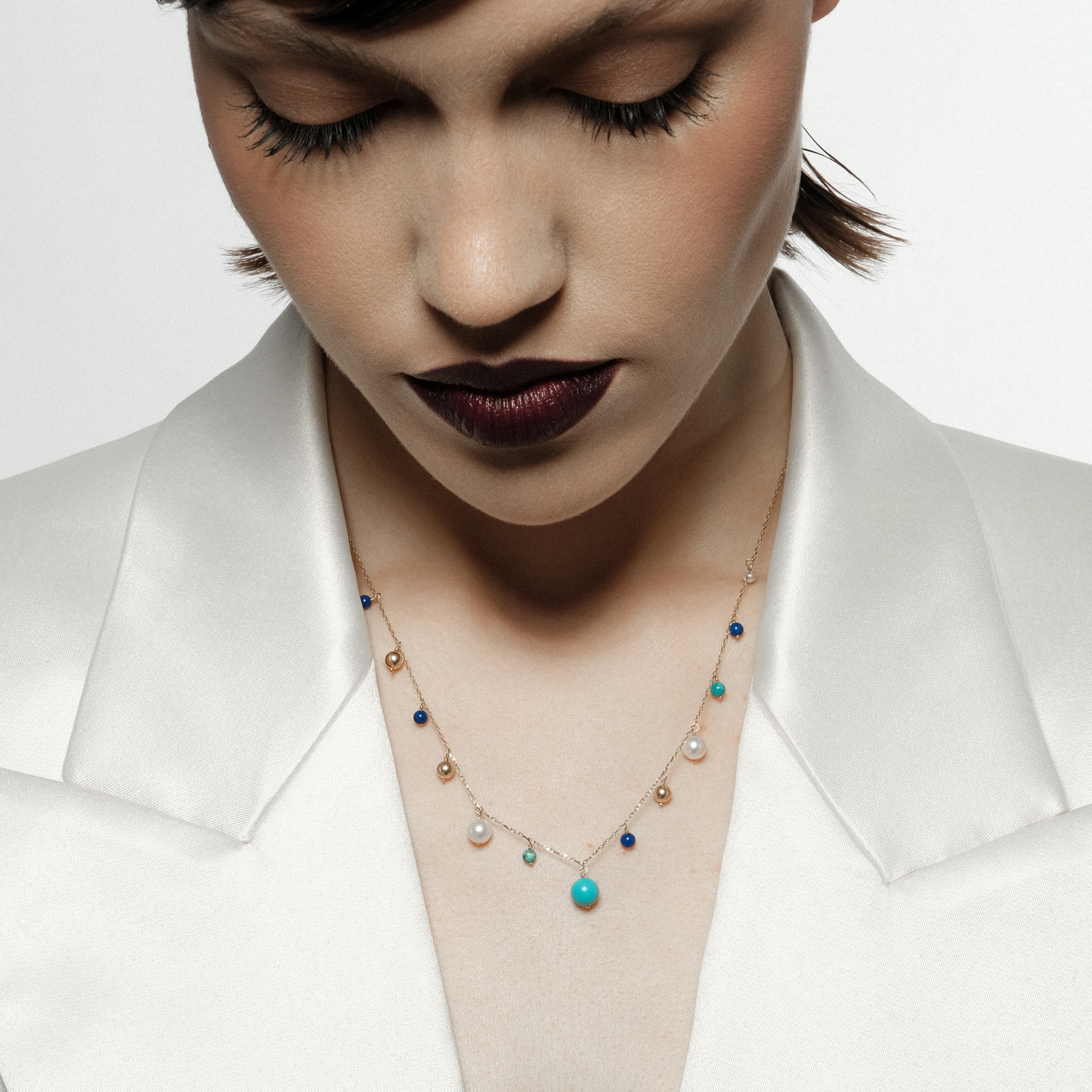 Gold necklace with pearl, turquoise and lapis pendants