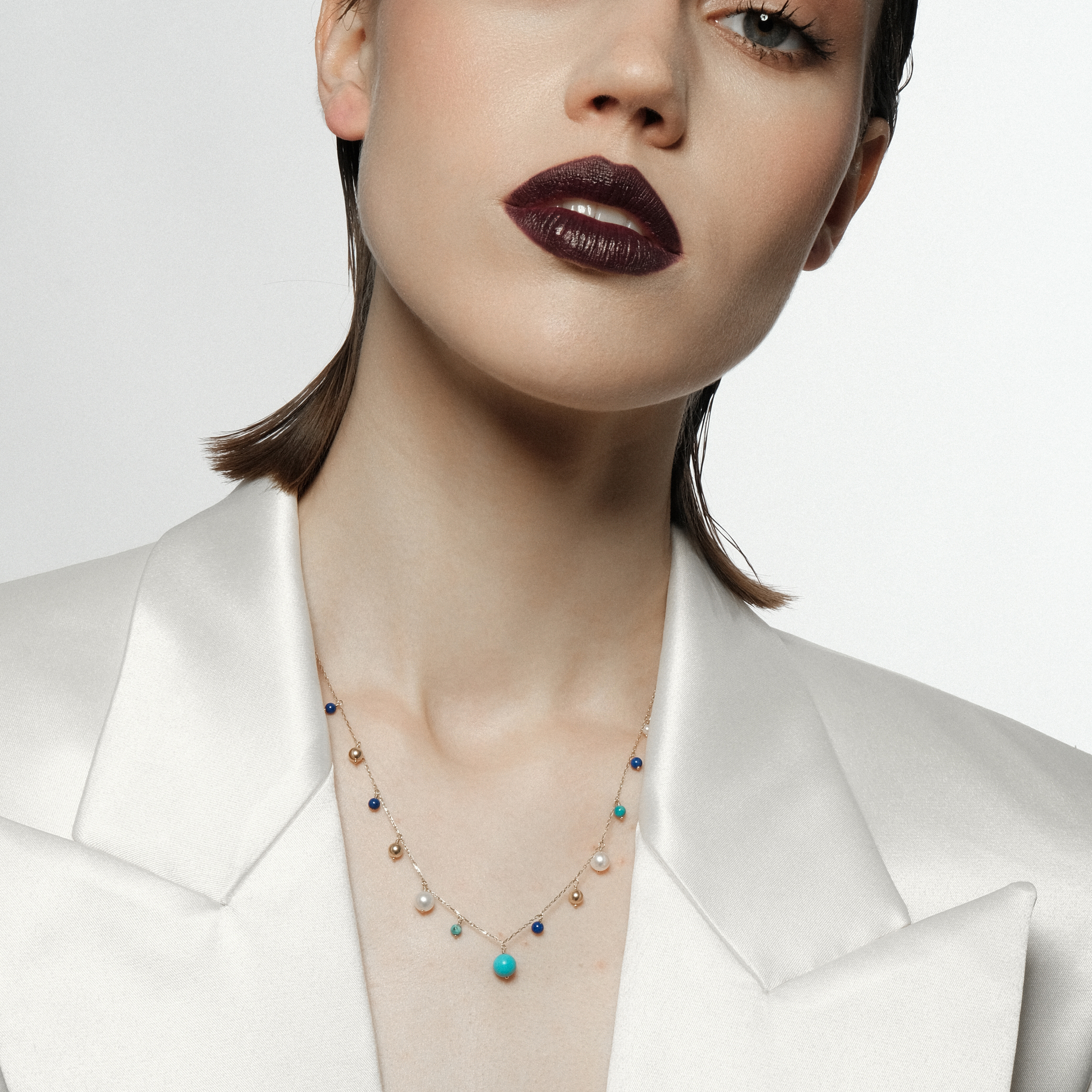 Gold necklace with pearl, turquoise and lapis pendants