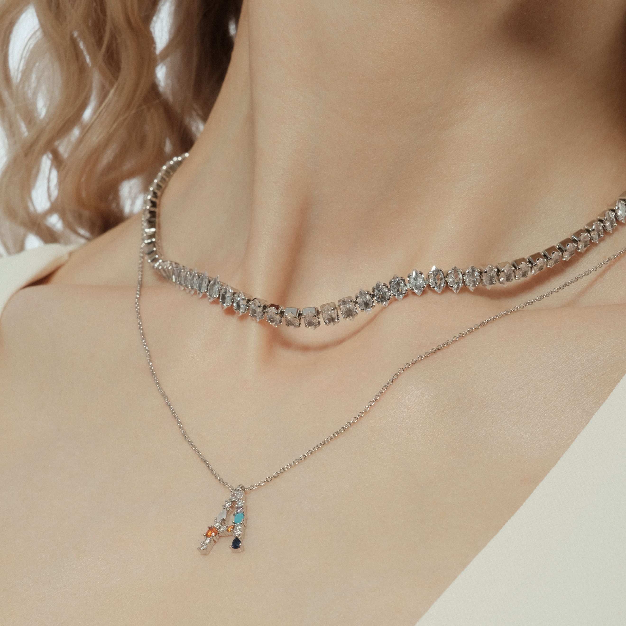 pendant with the letter A made of colored crystals
