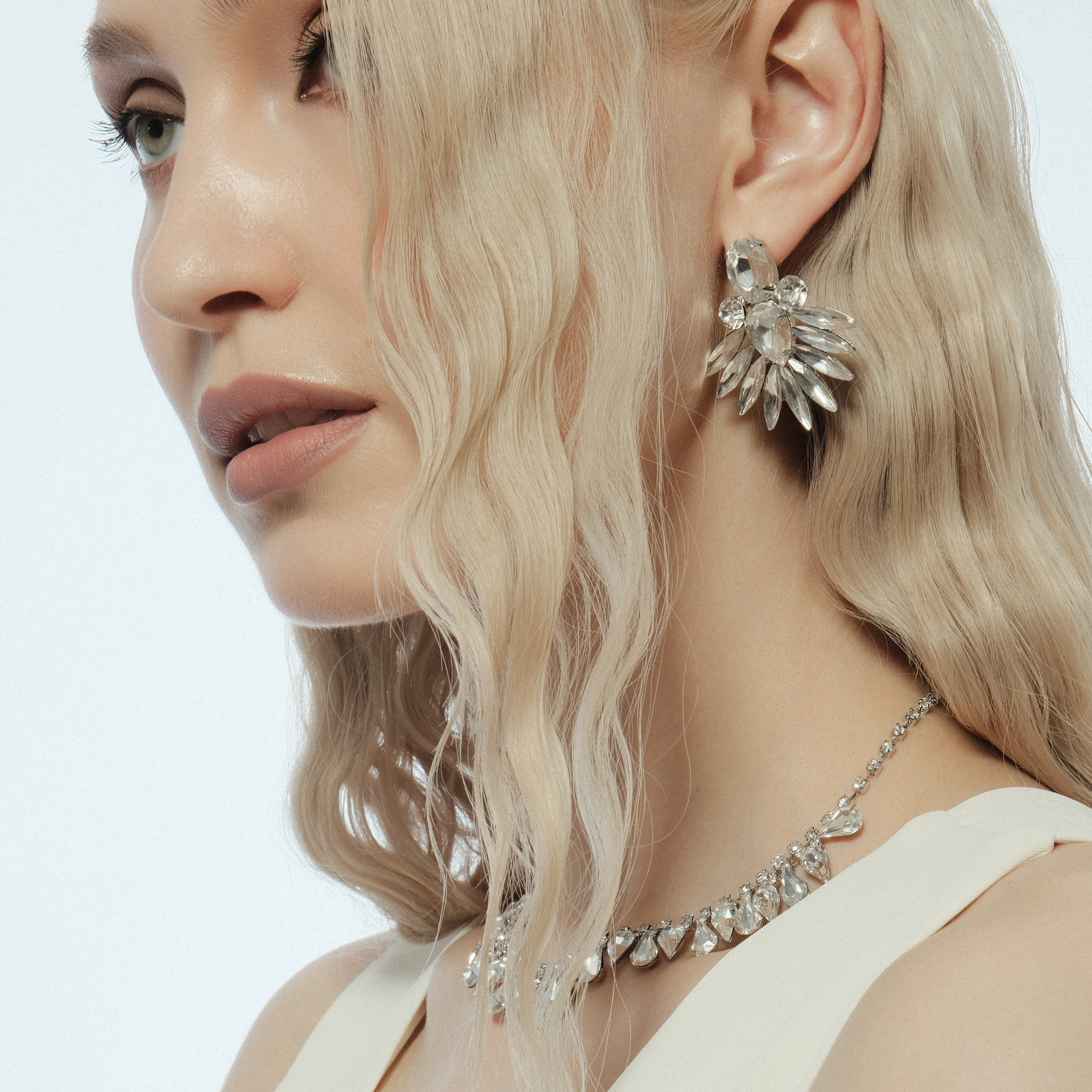 Silver earrings with crystals in the form of petals