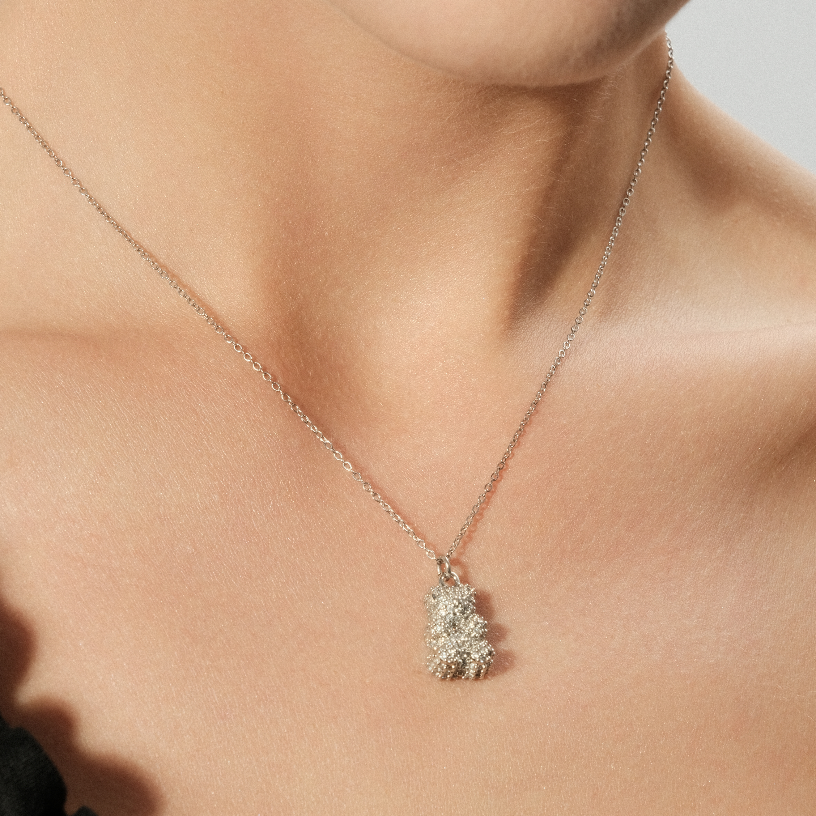 Silver necklace with a teddy bear pendant with crystals