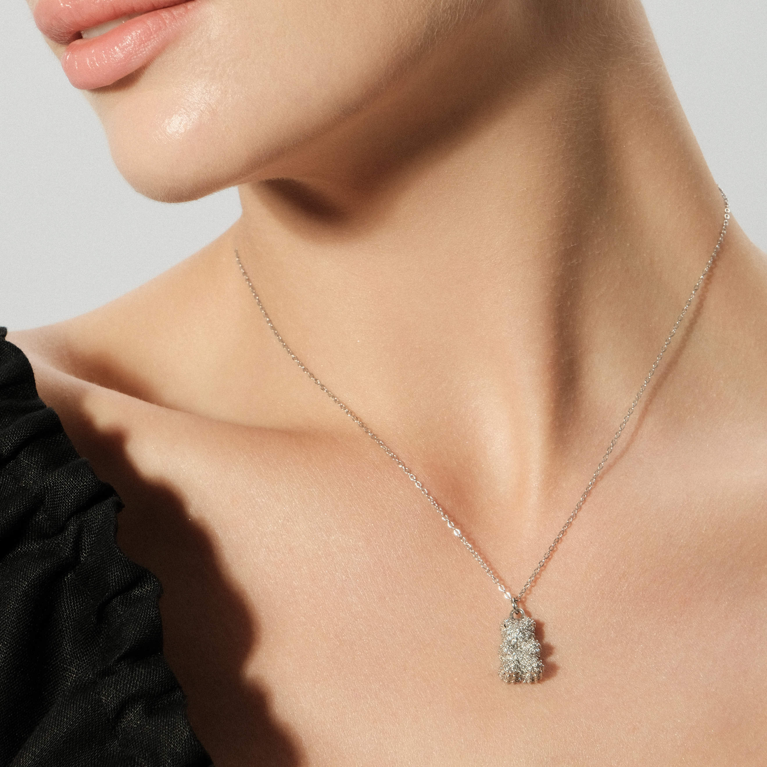 Silver necklace with a teddy bear pendant with crystals
