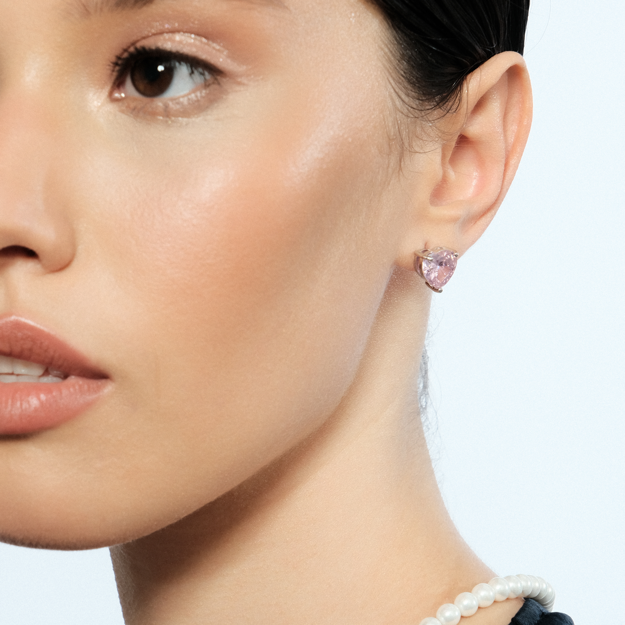 Silver earrings in the shape of a pink heart