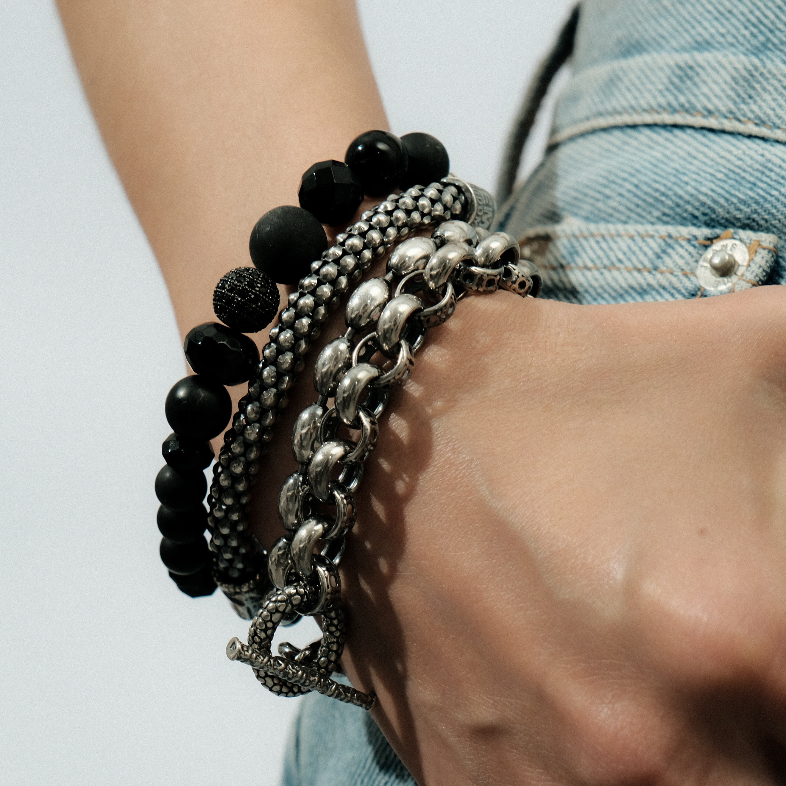 Triple silver bracelet with onyx beads