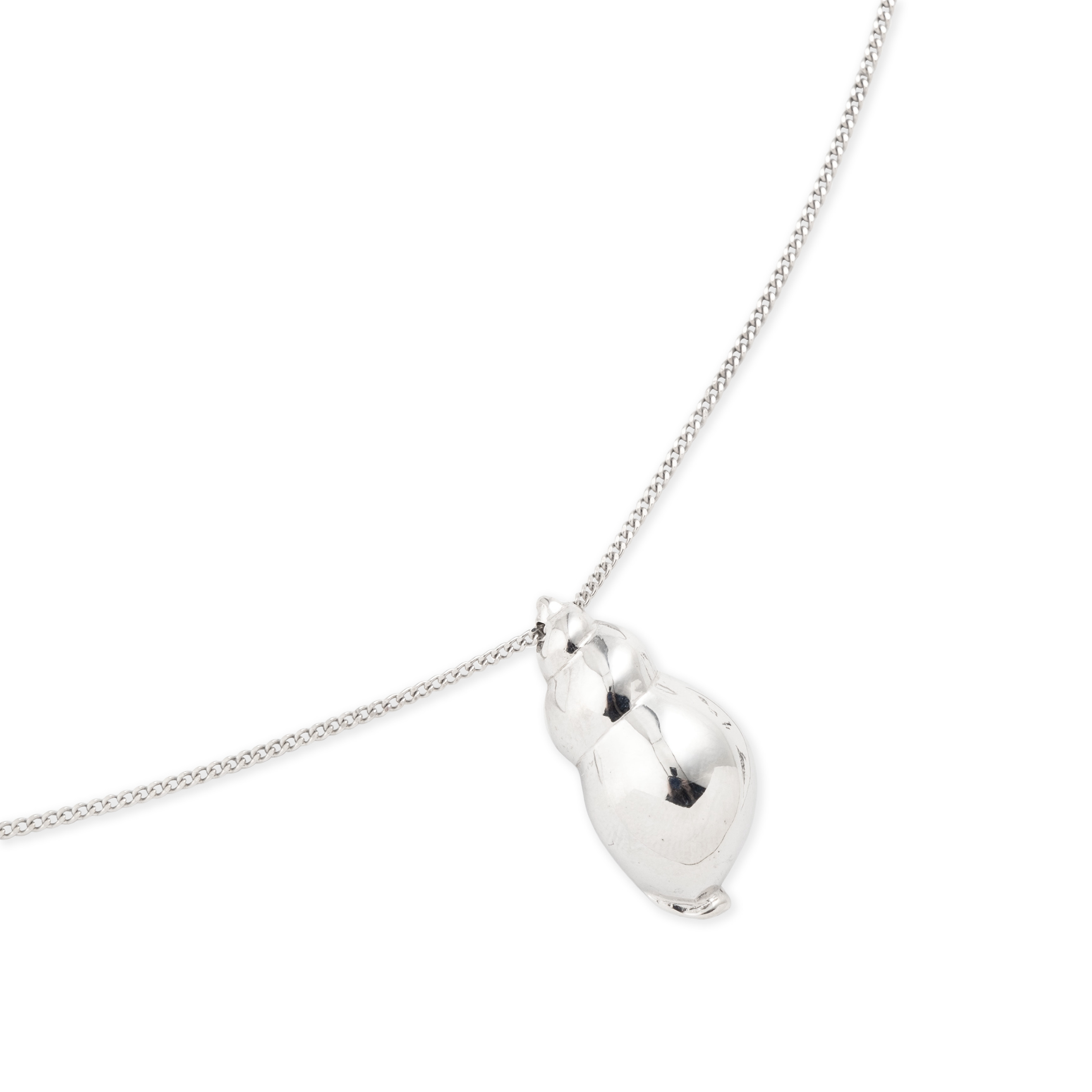 The Shell pendant is large made of white brass