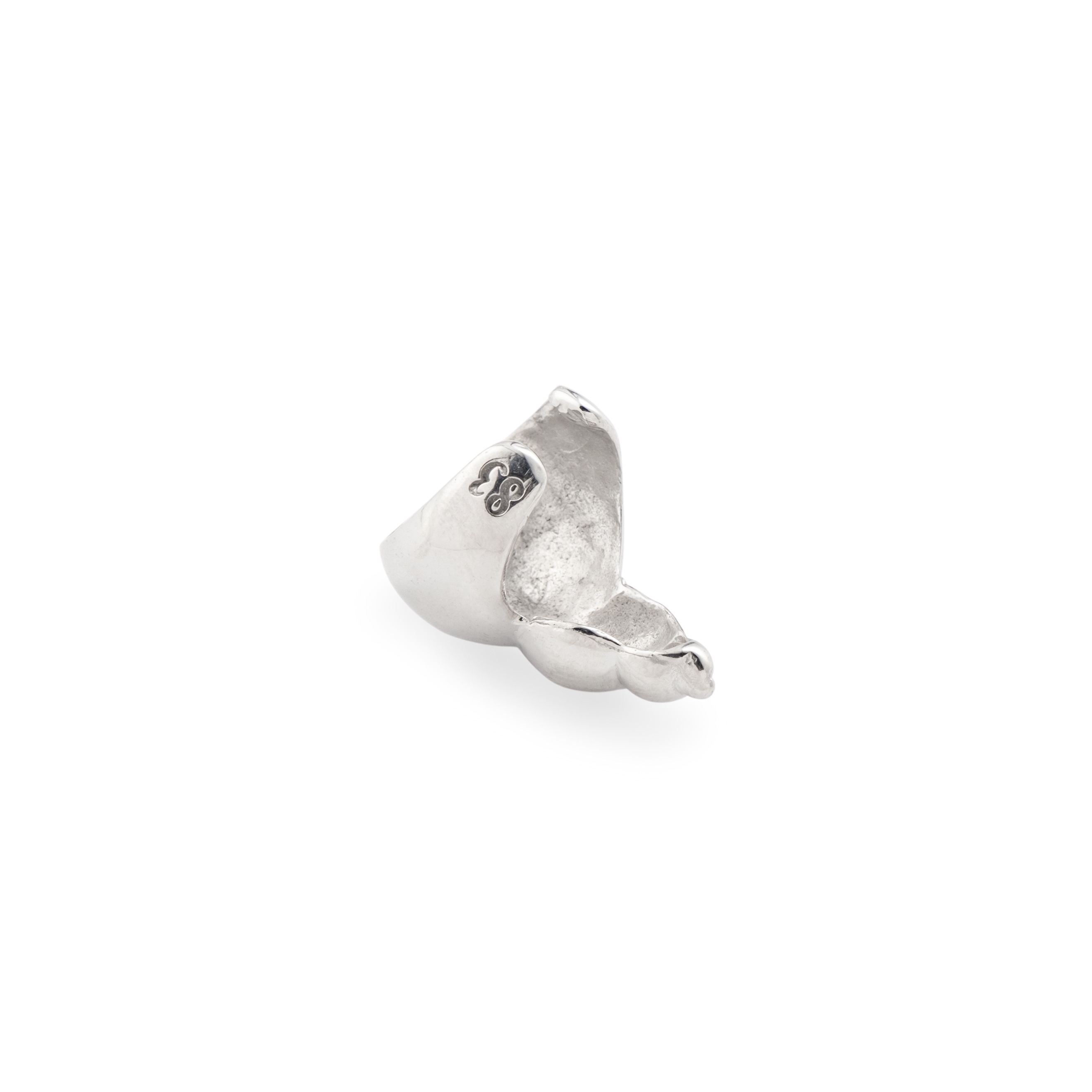 The "Shell" cuff made of white brass
