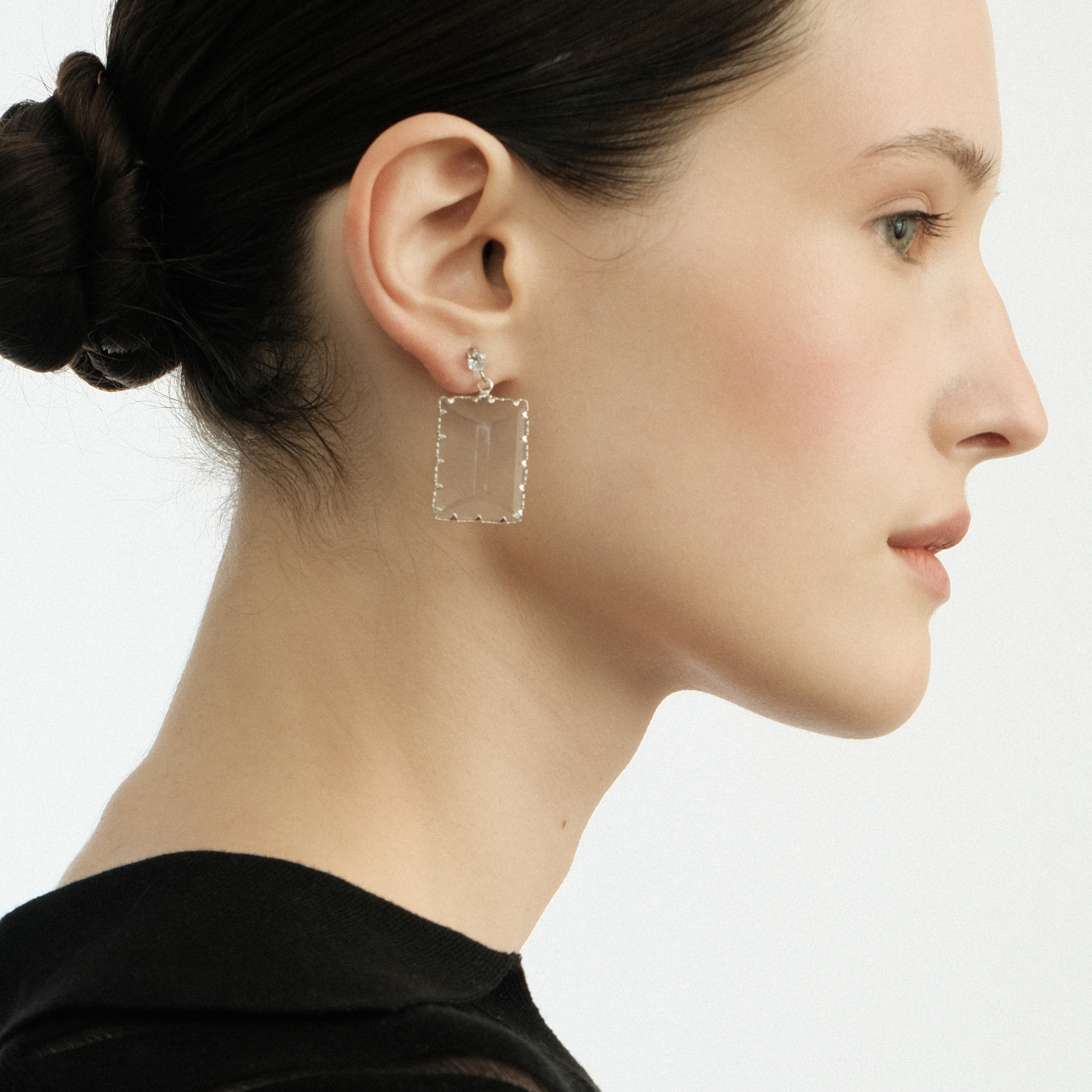 Earrings with a large transparent rectangular crystal