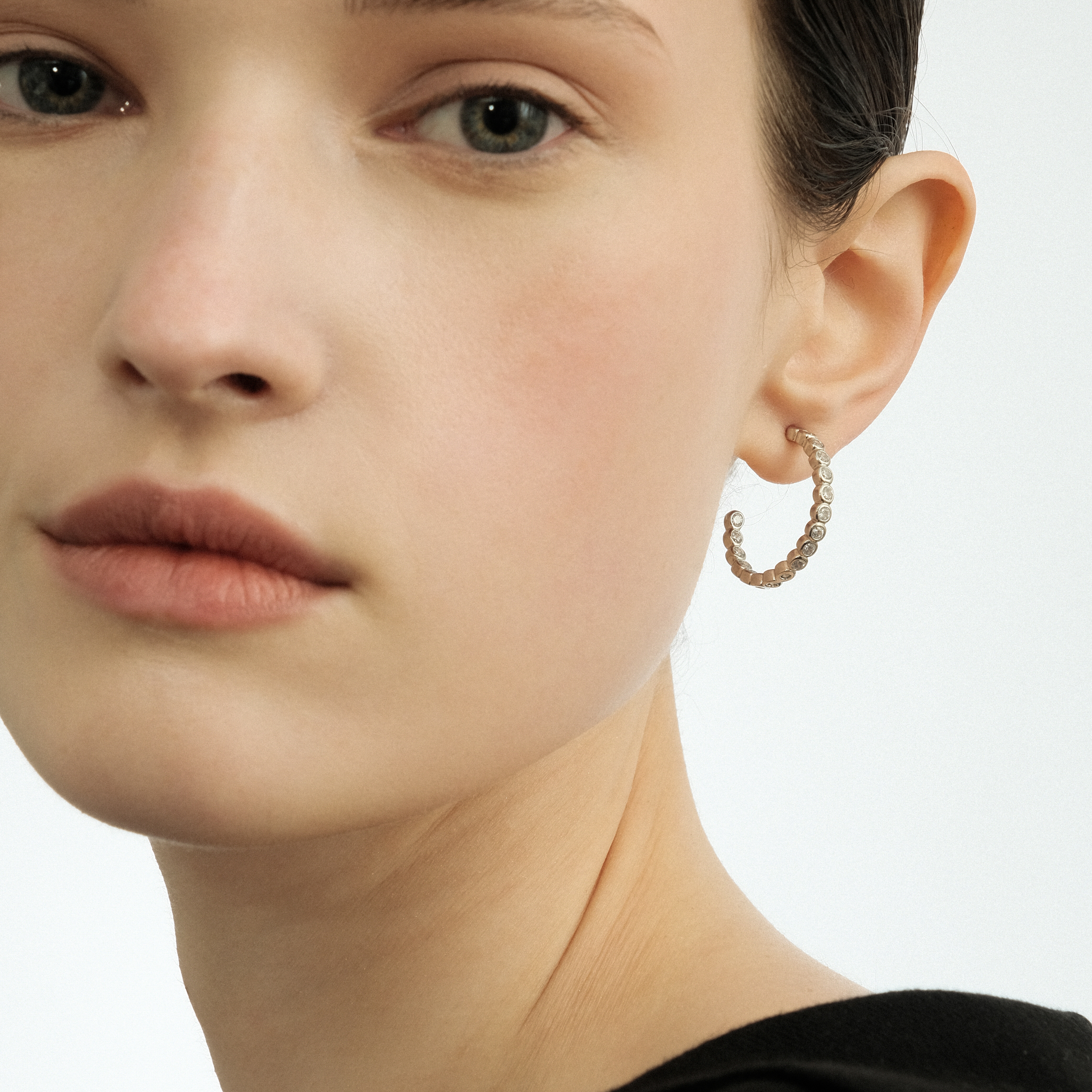 Silver hoop earrings made of round crystals