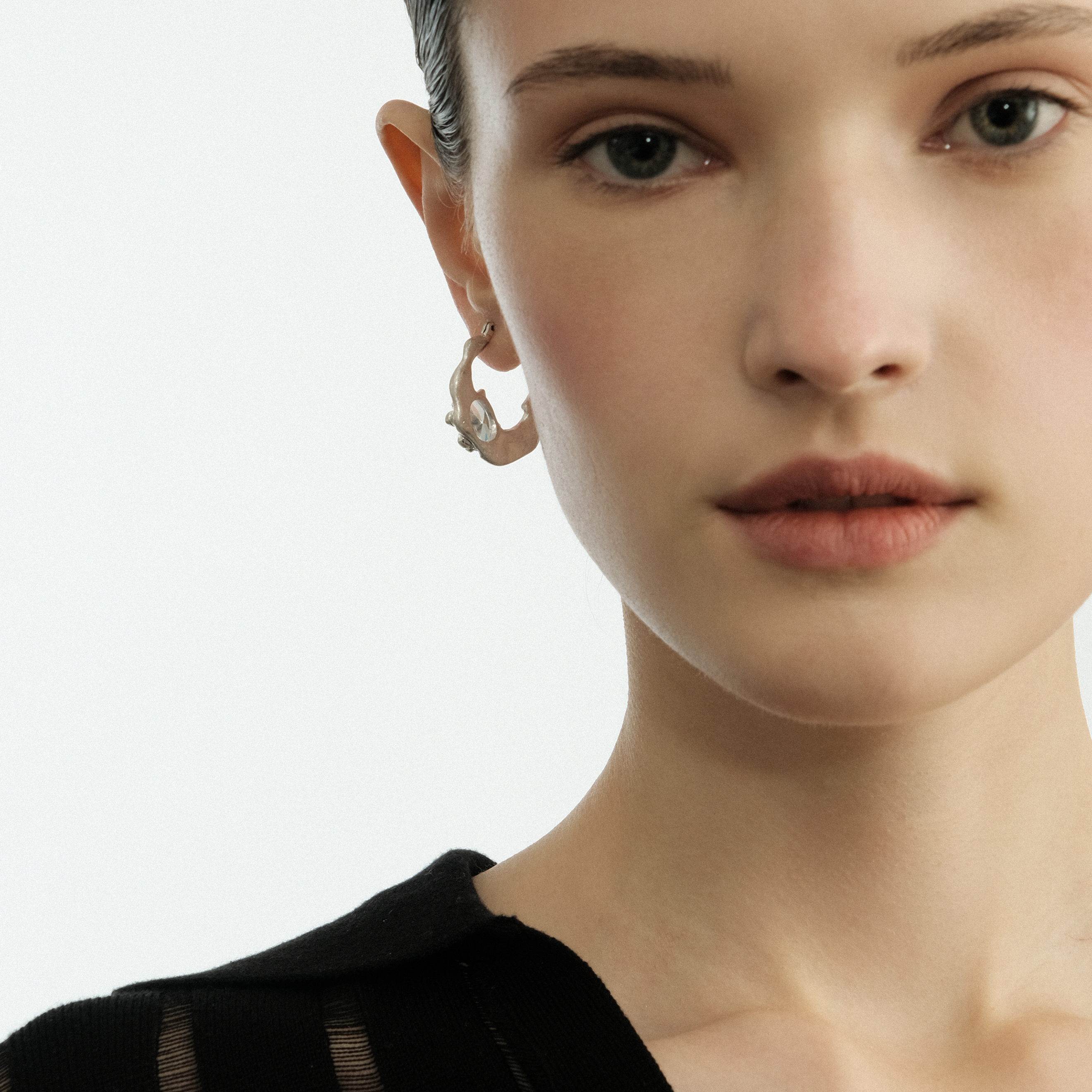 Small silver earrings with oval crystal