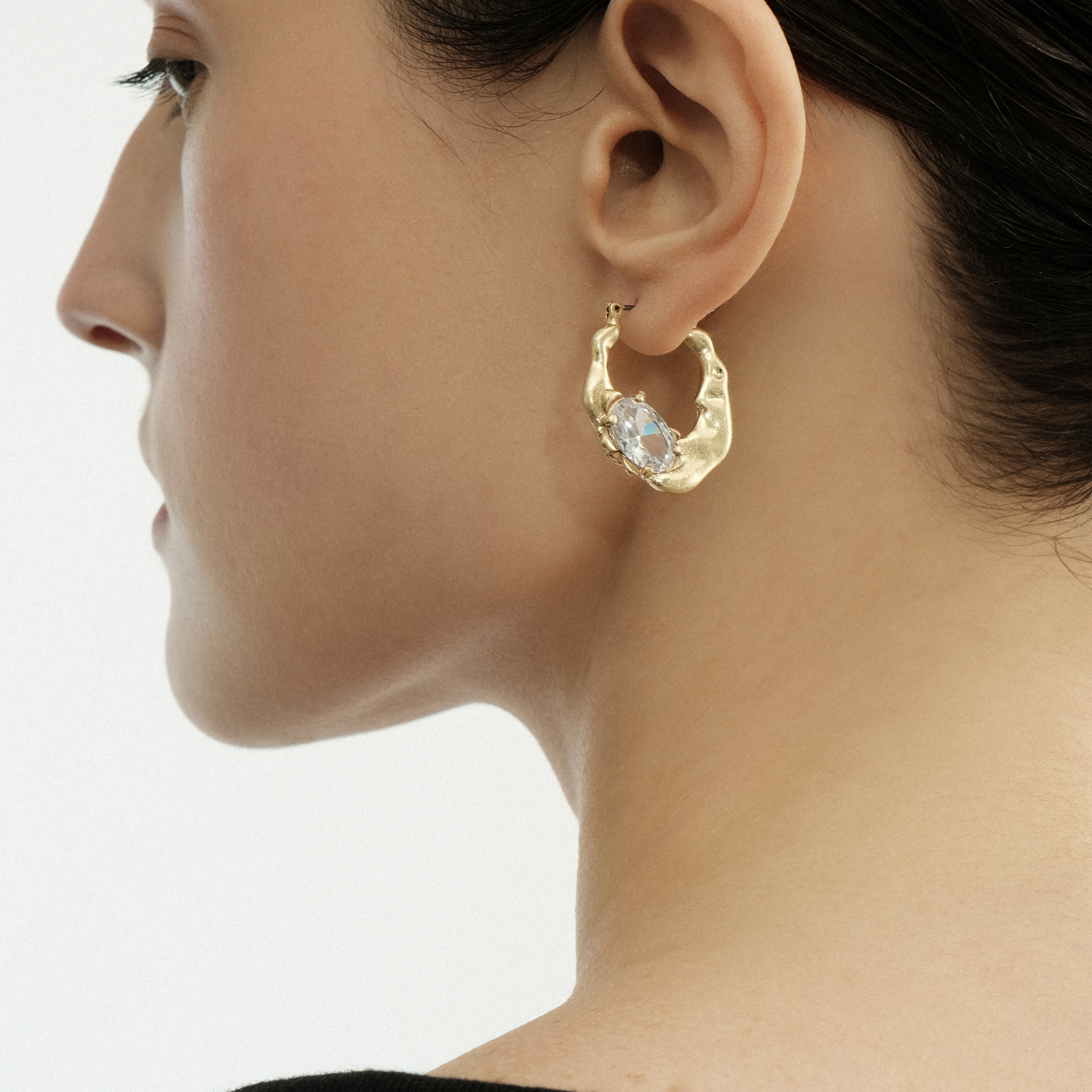Small golden earrings with oval crystal