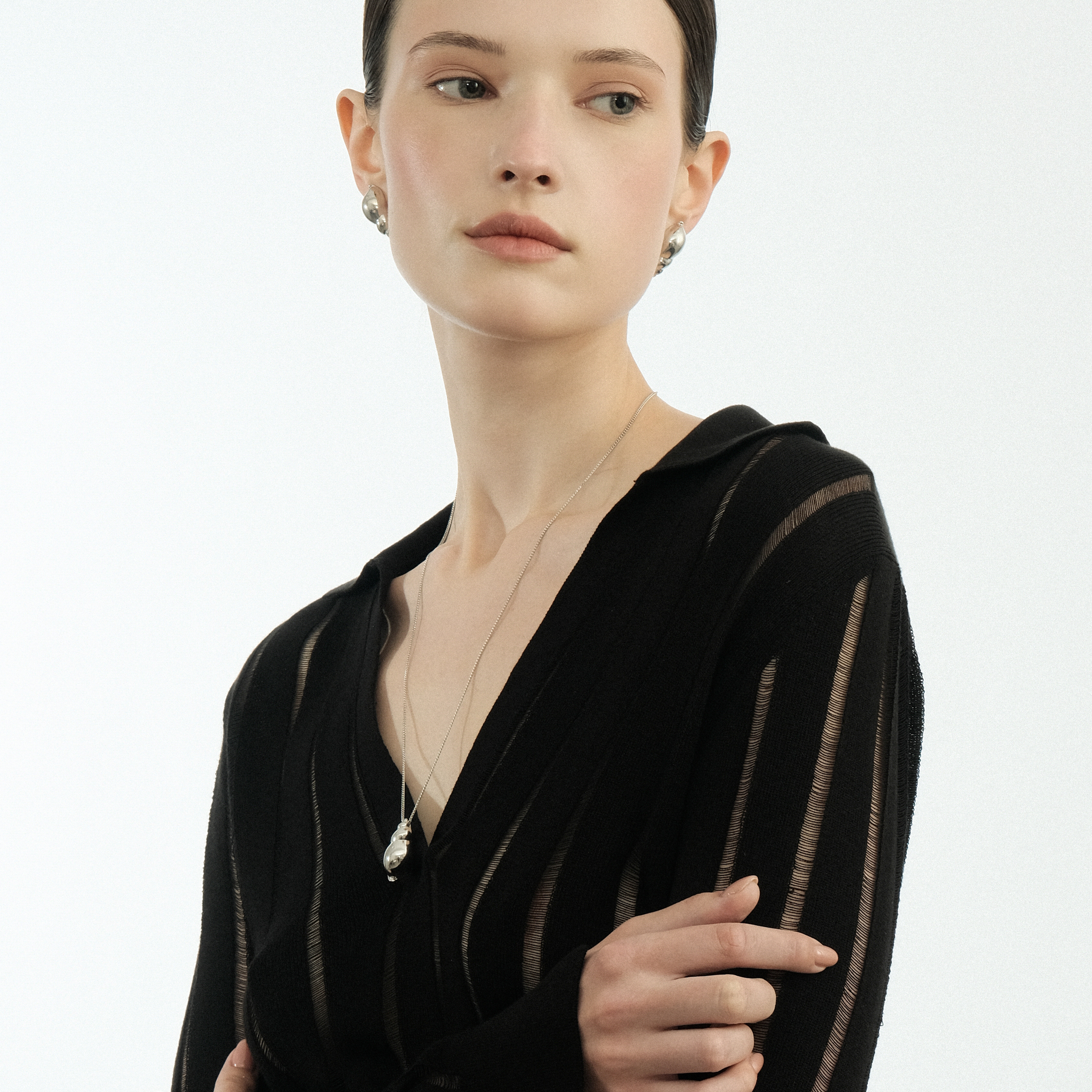 The Shell pendant is large made of white brass