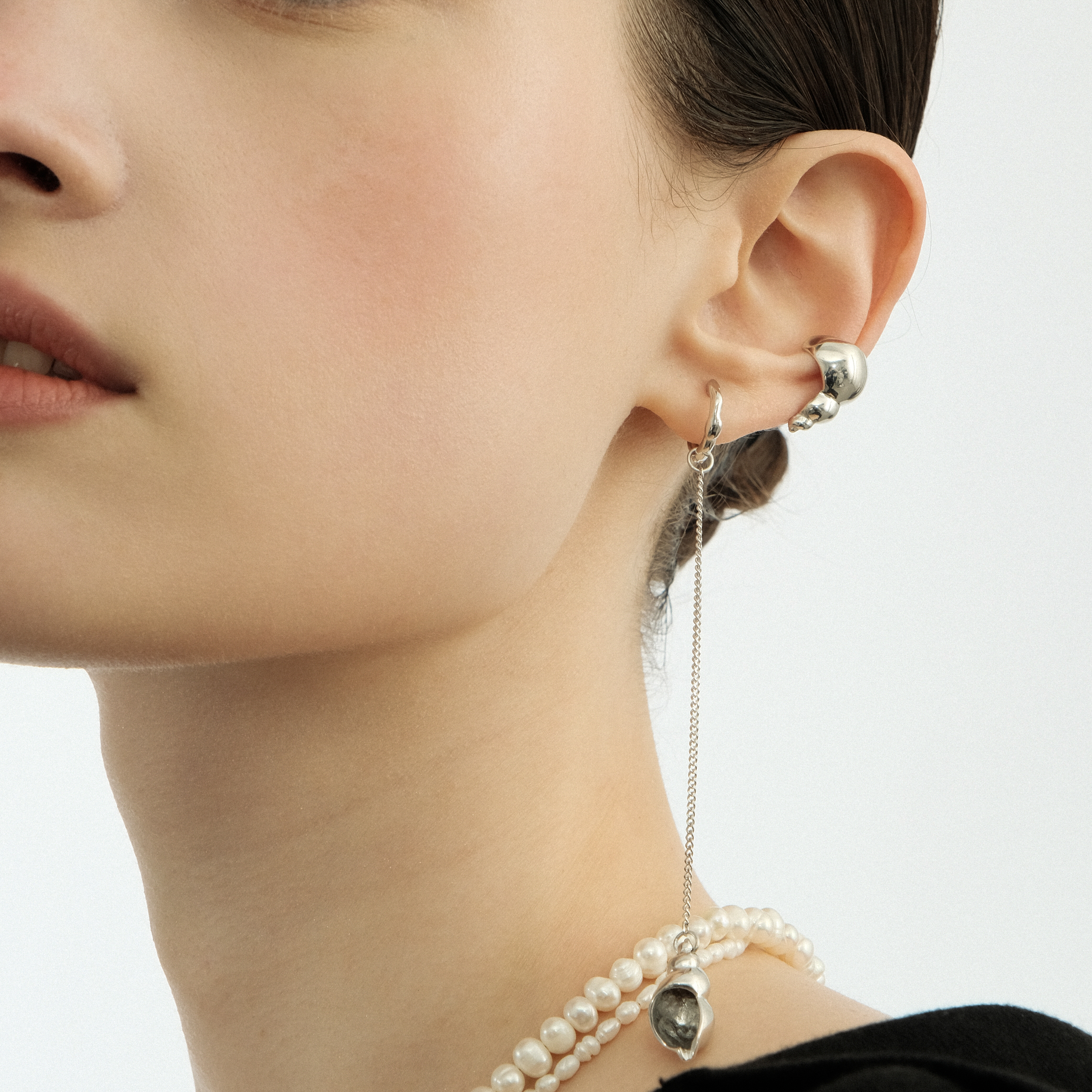 The "Shell" cuff made of white brass