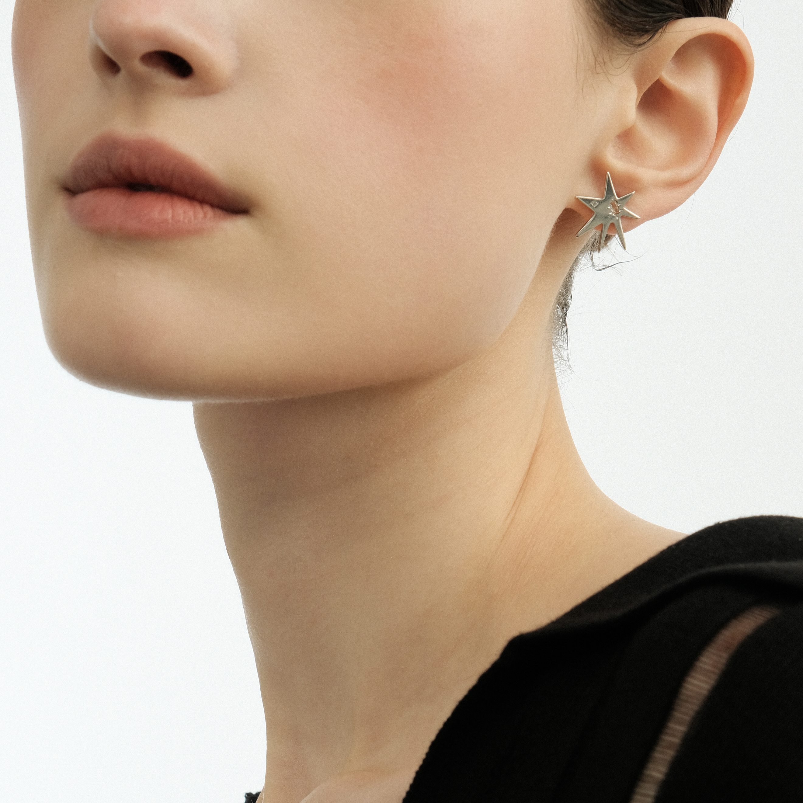 Star earrings made of white brass