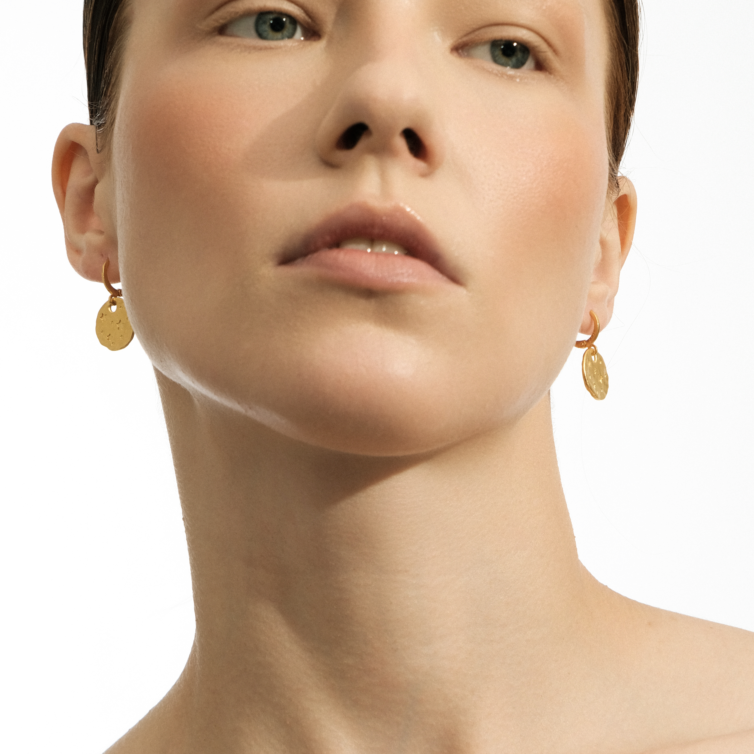 Gold-plated earrings with small coins with stars